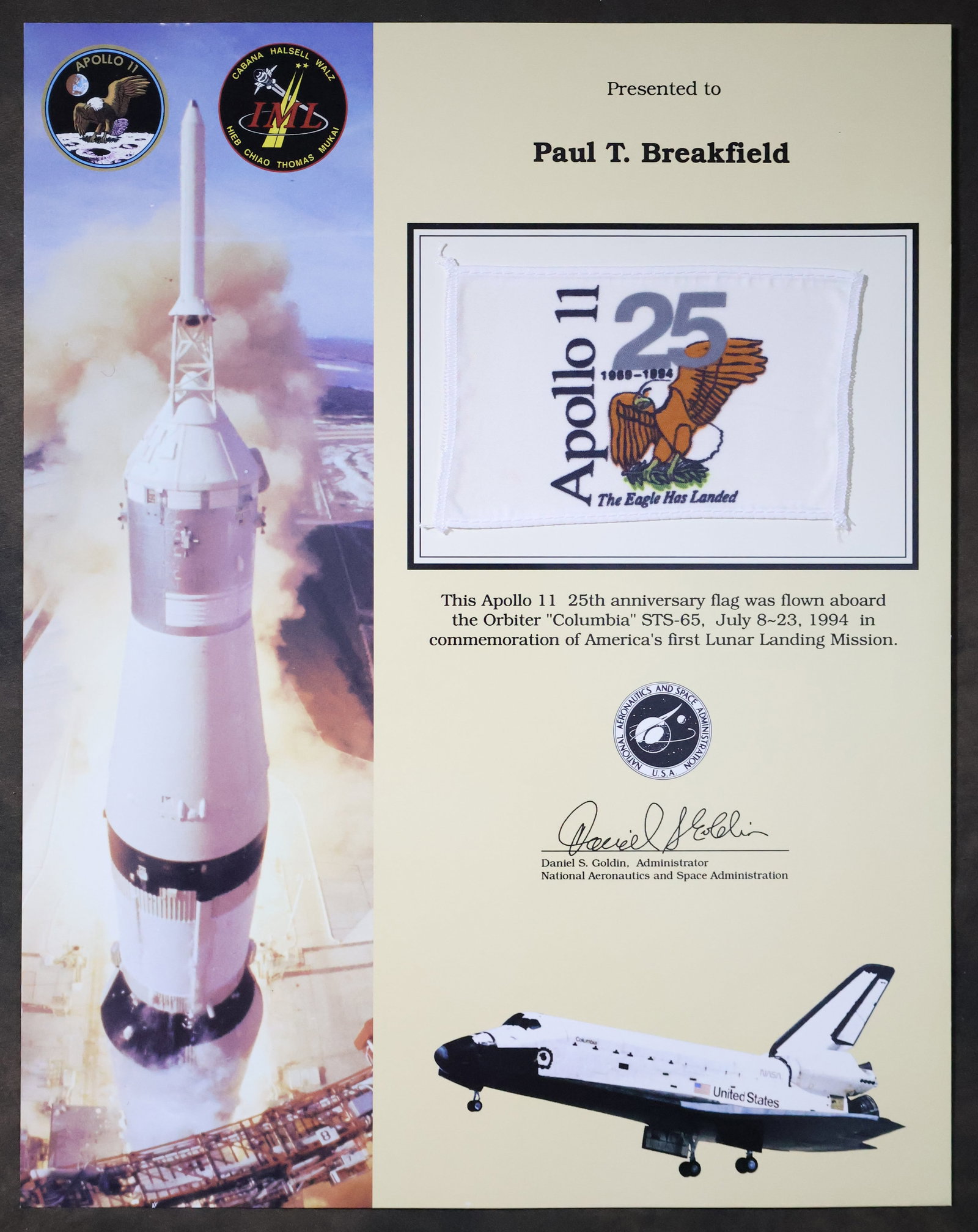 STS-65 Flown Apollo 11 Anniversary Flag Award: An Apollo 11 25th Anniversary appreciation award presentation that displays a 3" x 5" Apollo 11 25th Anniversary flag that was flown aboard the Space Shuttle "Columbia" STS-65 mission. This 11" x 14" 