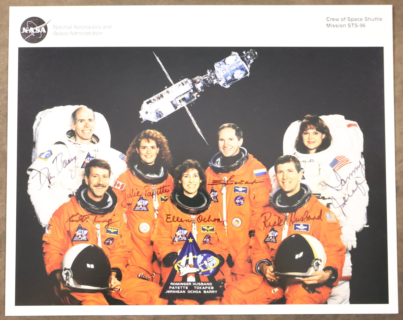 STS-96 Full Crew Signed NASA Lithograph: An original NASA issued lithograph for the STS-96 mission. This 8" x 10" lithograph has been hand signed by the full crew members - Kent Rominger, Rick Husband, Tamara Jernigan, Daniel Barry, Ellen
