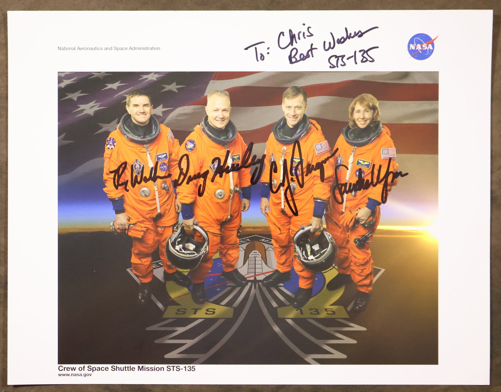 STS-135 Full Crew Signed NASA Lithograph: An NASA issued lithograph for the STS-135 mission. This 8.5" x 11" lithograph has been hand signed and dedicated by the full crew members - Christopher Ferguson, Douglas Hurley, Sandra Magnus and Rex 