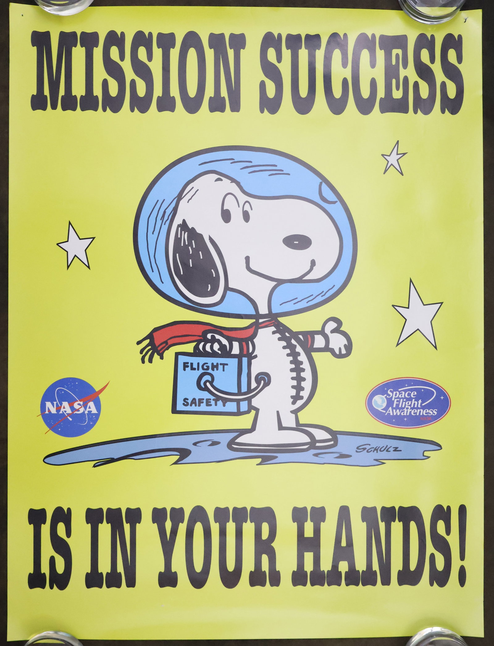 NASA "Mission Success" Snoopy Poster: This is a NASA Space Flight Awareness 18" x 24" Snoopy flight safety poster titled "Mission Success Is In Your Hands!". It is in excellent beautiful condition with minor handling wear, a pin hole in t