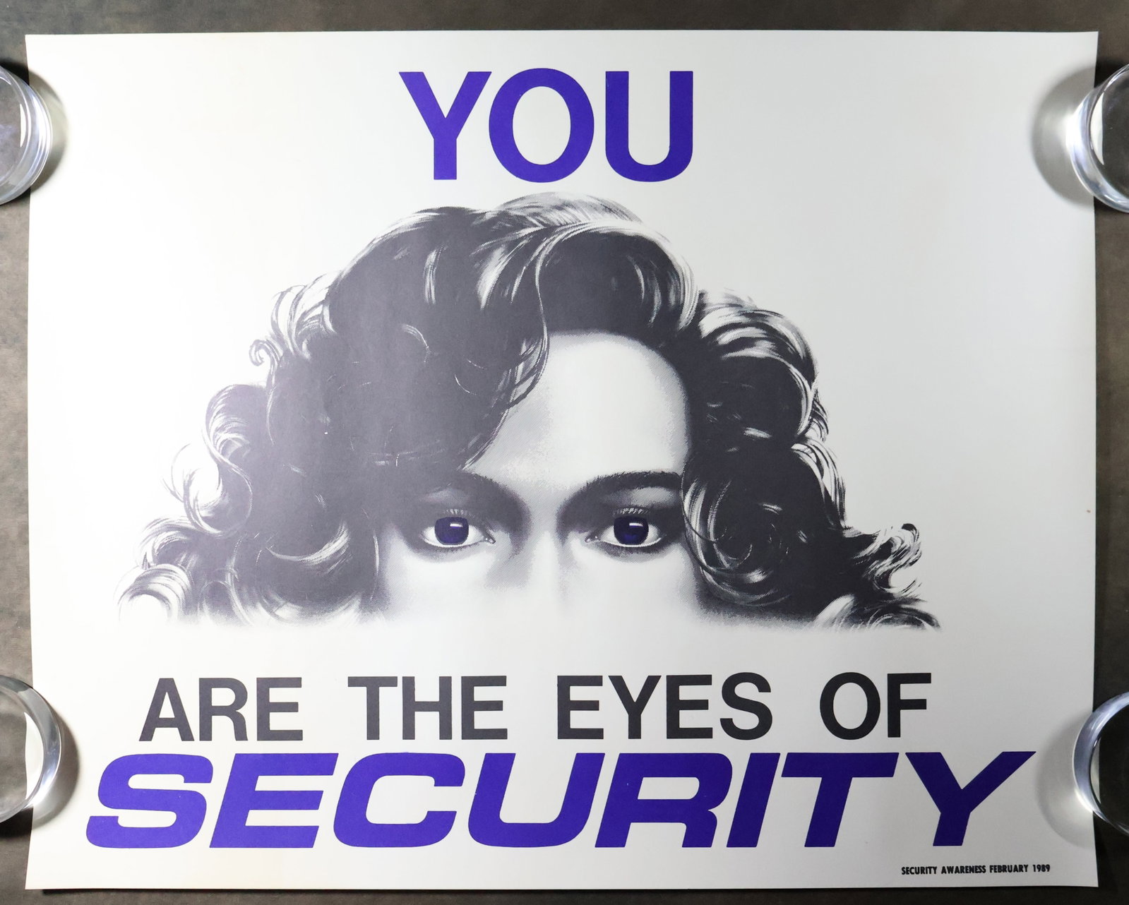 1989 KSC "Eyes of Security" Poster: A Kennedy Space Center Security Awareness poster dated February 1989. The poster statement reads "You are the Eyes of Security". This 16" x 20" poster is in near mint condition with very minor handlin