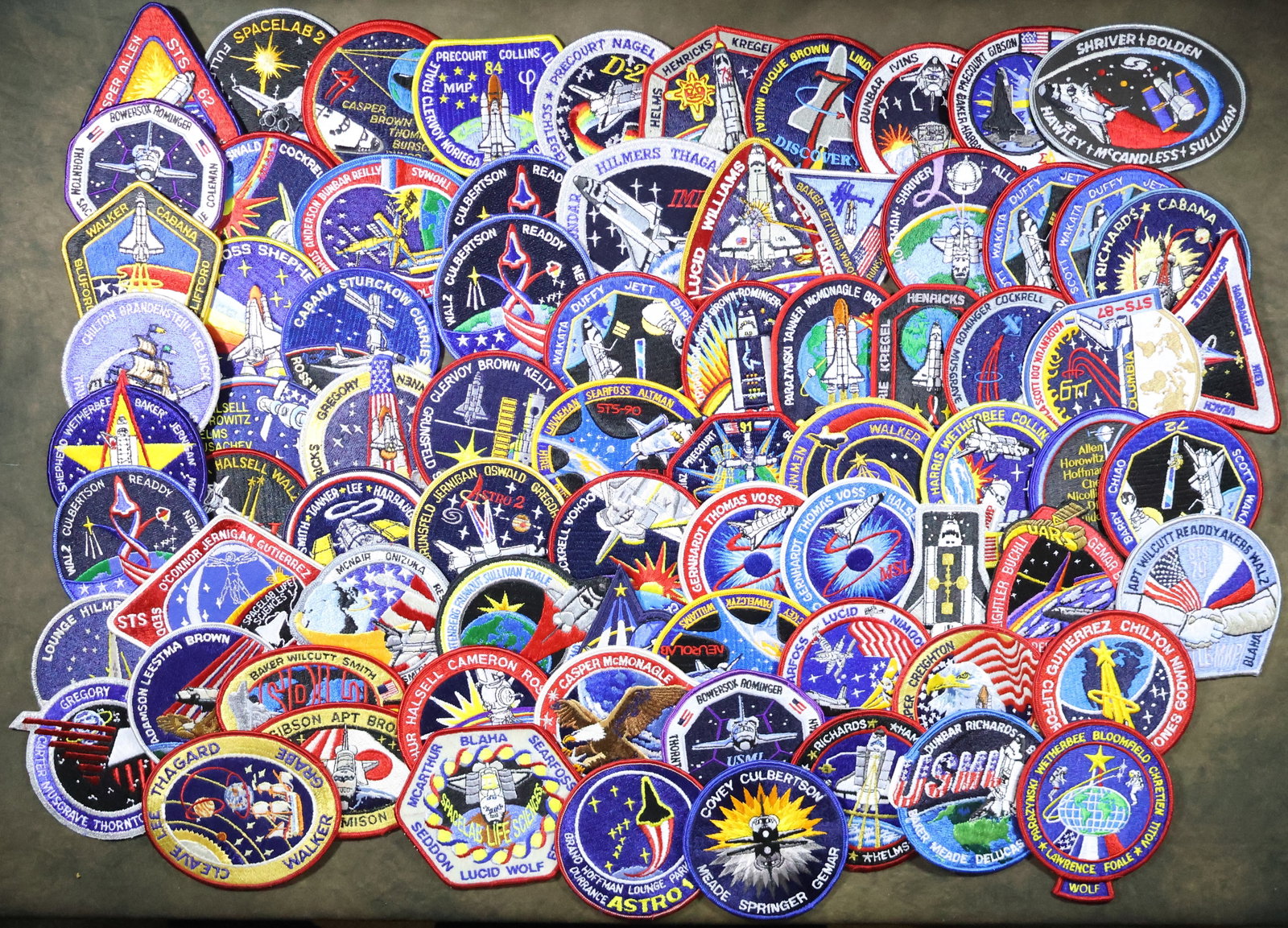 75 - Space Shuttle Mission Patches: A great collection of seventy five patches from various Space Shuttle Missions from throughout the program. There is very little duplication. The patches are all in excellent to near mint condition.