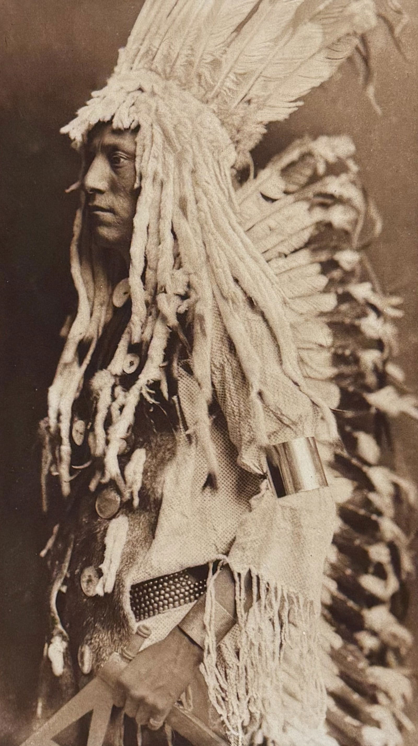 Edward Curtis, Folio - Old Person - Piegan: This moving photogravure in folio size is from Edward Curtis's The North American Indian being a Series of Volumes Picturing and Describing the Indians of the United States and Alaska. Edited by Frede