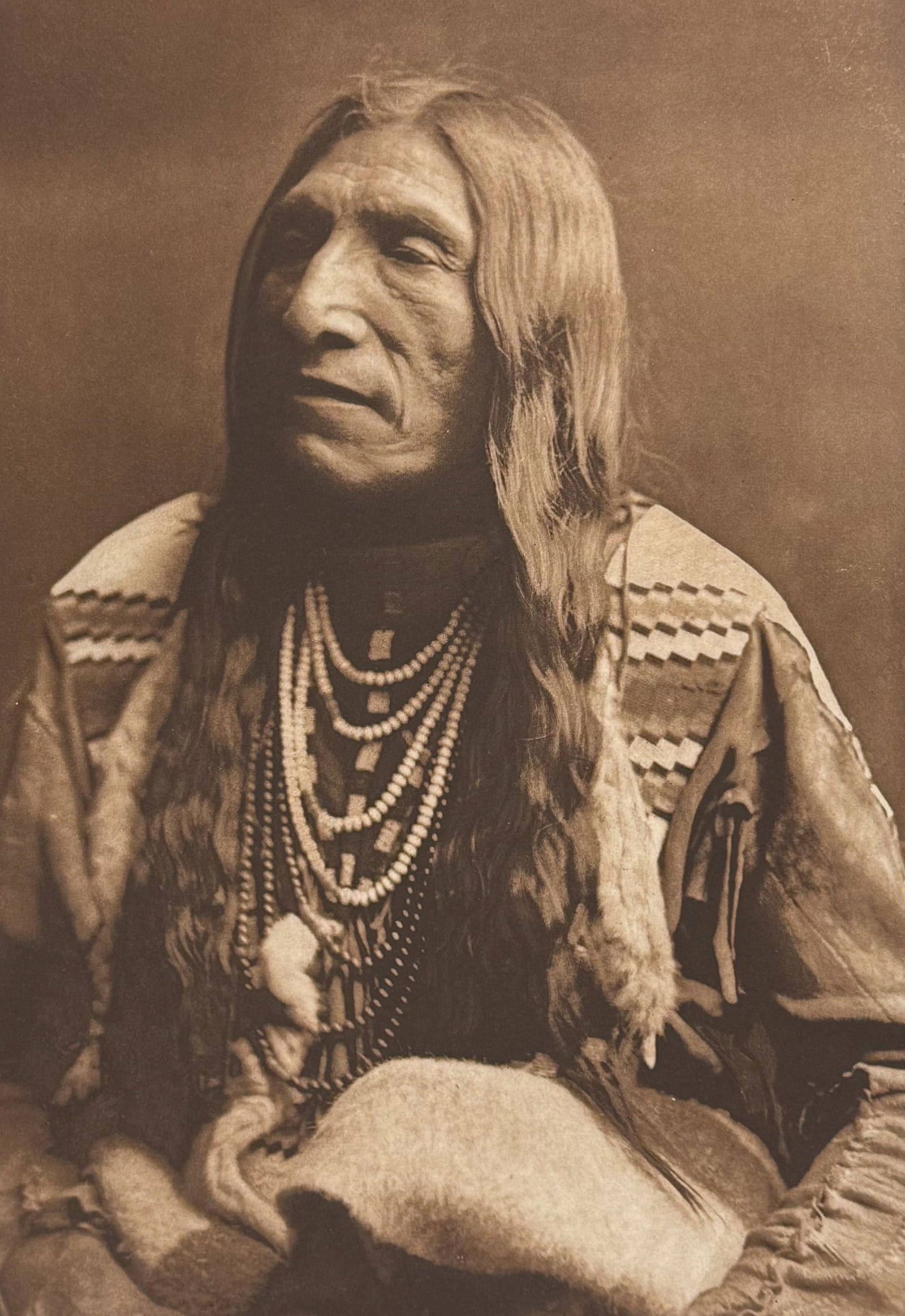 Edward Curtis, Folio - Double Runner - Piegan: This moving photogravure in folio size is from Edward Curtis's The North American Indian being a Series of Volumes Picturing and Describing the Indians of the United States and Alaska. Edited by Frede