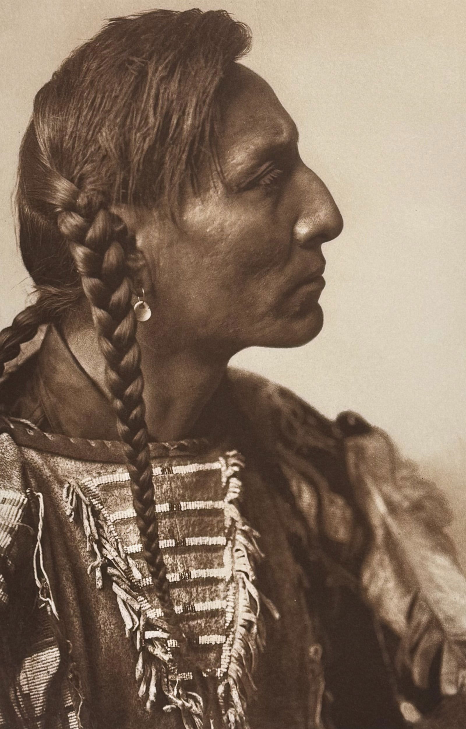 Edward Curtis, Folio - Spotted Bull - Mandan: This moving photogravure in folio size is from Edward Curtis's The North American Indian being a Series of Volumes Picturing and Describing the Indians of the United States and Alaska. Edited by Frede