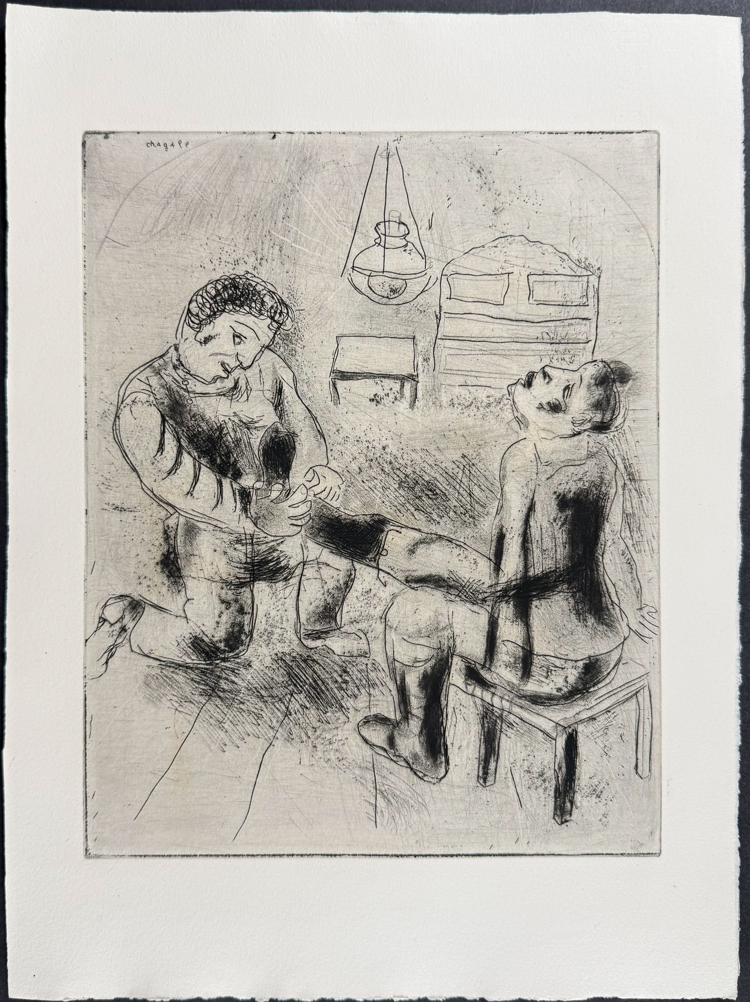 Chagall - Petrouchka Reiterates the Boots - Petrouchka Reitre les Bottes: This beautifully illustrated, original etching by Marc Chagall was part of Nikolai Gogol's Les Ames Mortes. The work was published in Paris by Teriade in 1948. This was a limited edition of 368 copies
