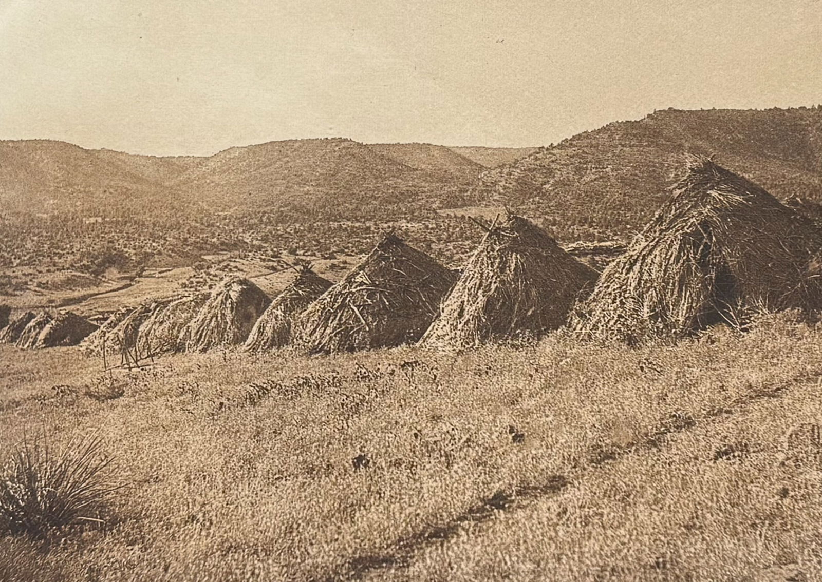 Edward Curtis - Apache Village: This moving photogravure in quarto size is from Edward Curtis's The North American Indian being a Series of Volumes Picturing and Describing the Indians of the United States and Alaska. Edited by