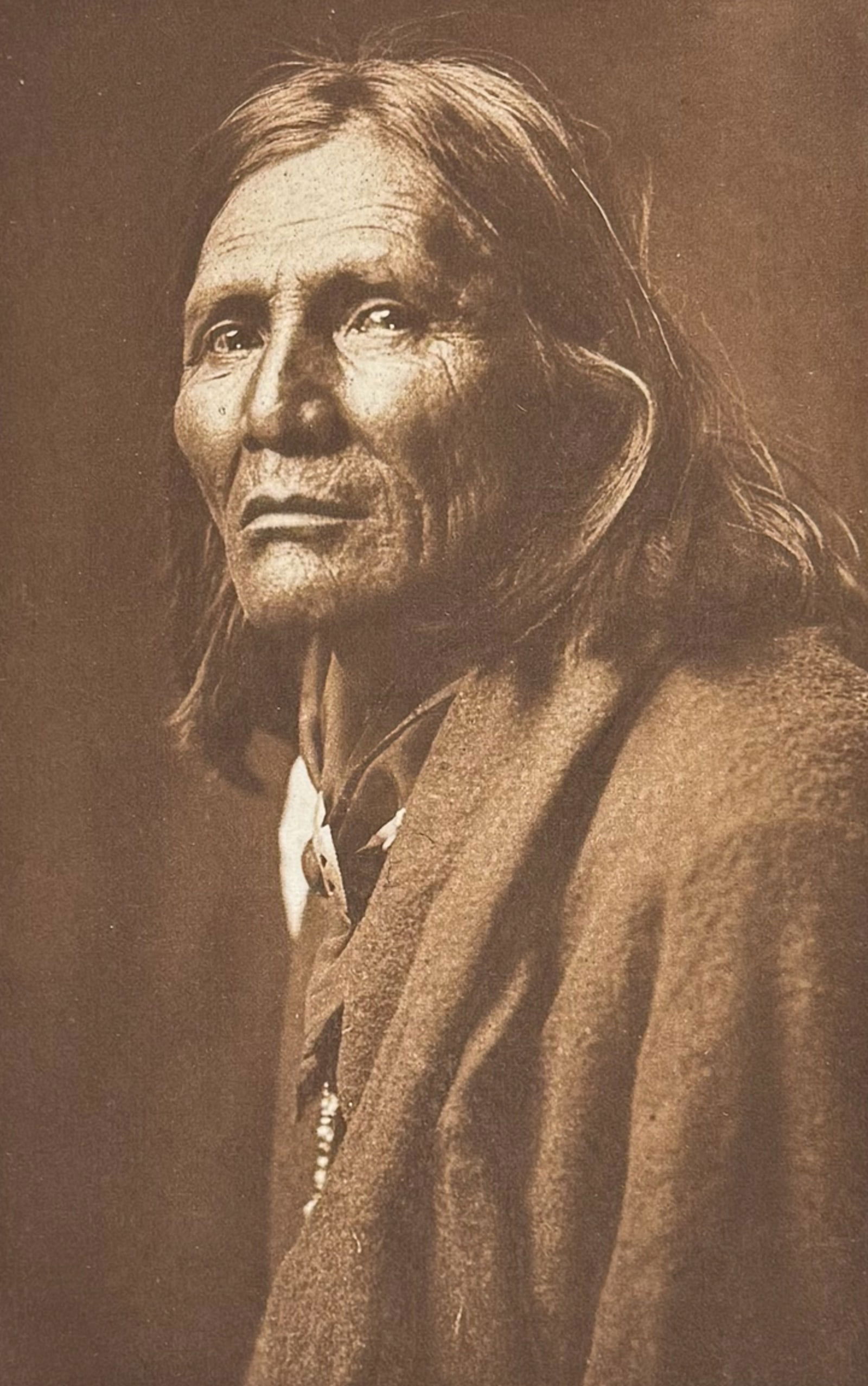 Edward Curtis - Alchise - Apache: This moving photogravure in quarto size is from Edward Curtis's The North American Indian being a Series of Volumes Picturing and Describing the Indians of the United States and Alaska. Edited by Fred