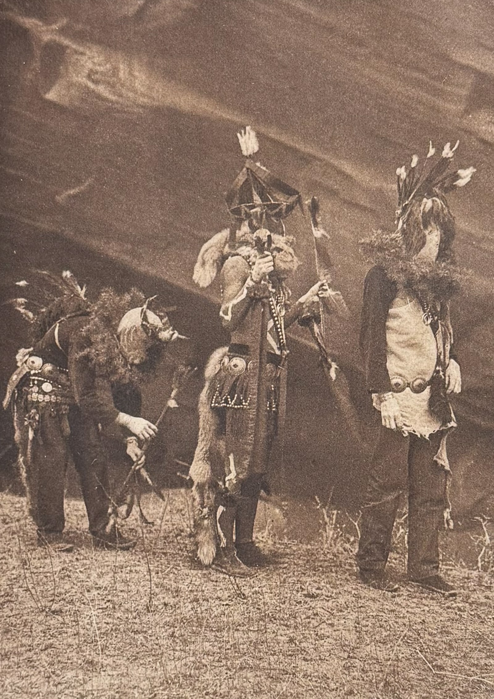 Edward Curtis - Garaskidi, Zahadolzha, Haschelti - Navaho: This moving photogravure in quarto size is from Edward Curtis's The North American Indian being a Series of Volumes Picturing and Describing the Indians of the United States and Alaska. Edited by Fred