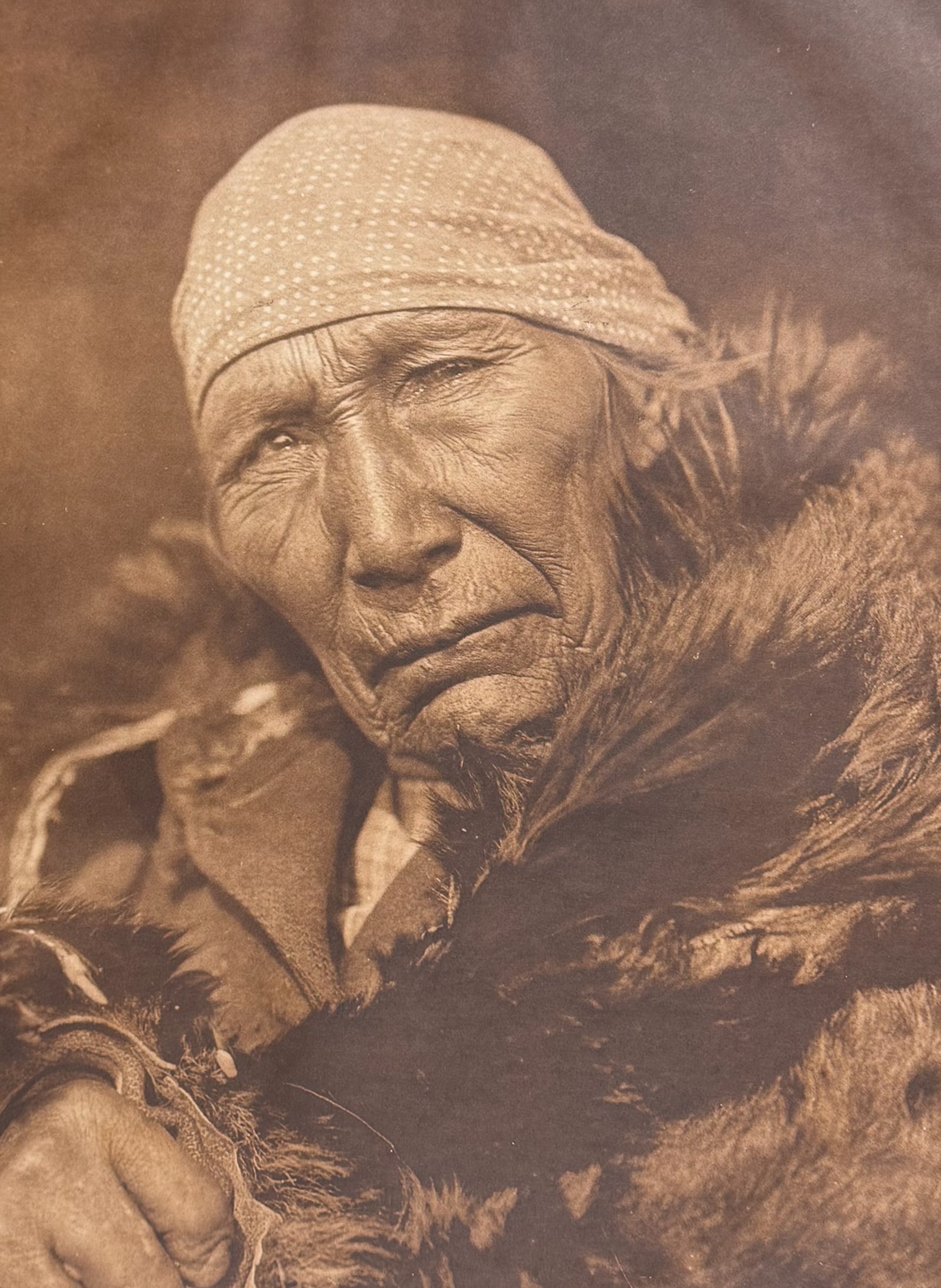 Edward Curtis, Folio - Soyaksin - Blood: This moving photogravure in folio size is from Edward Curtis's The North American Indian being a Series of Volumes Picturing and Describing the Indians of the United States and Alaska. Edited by Frede