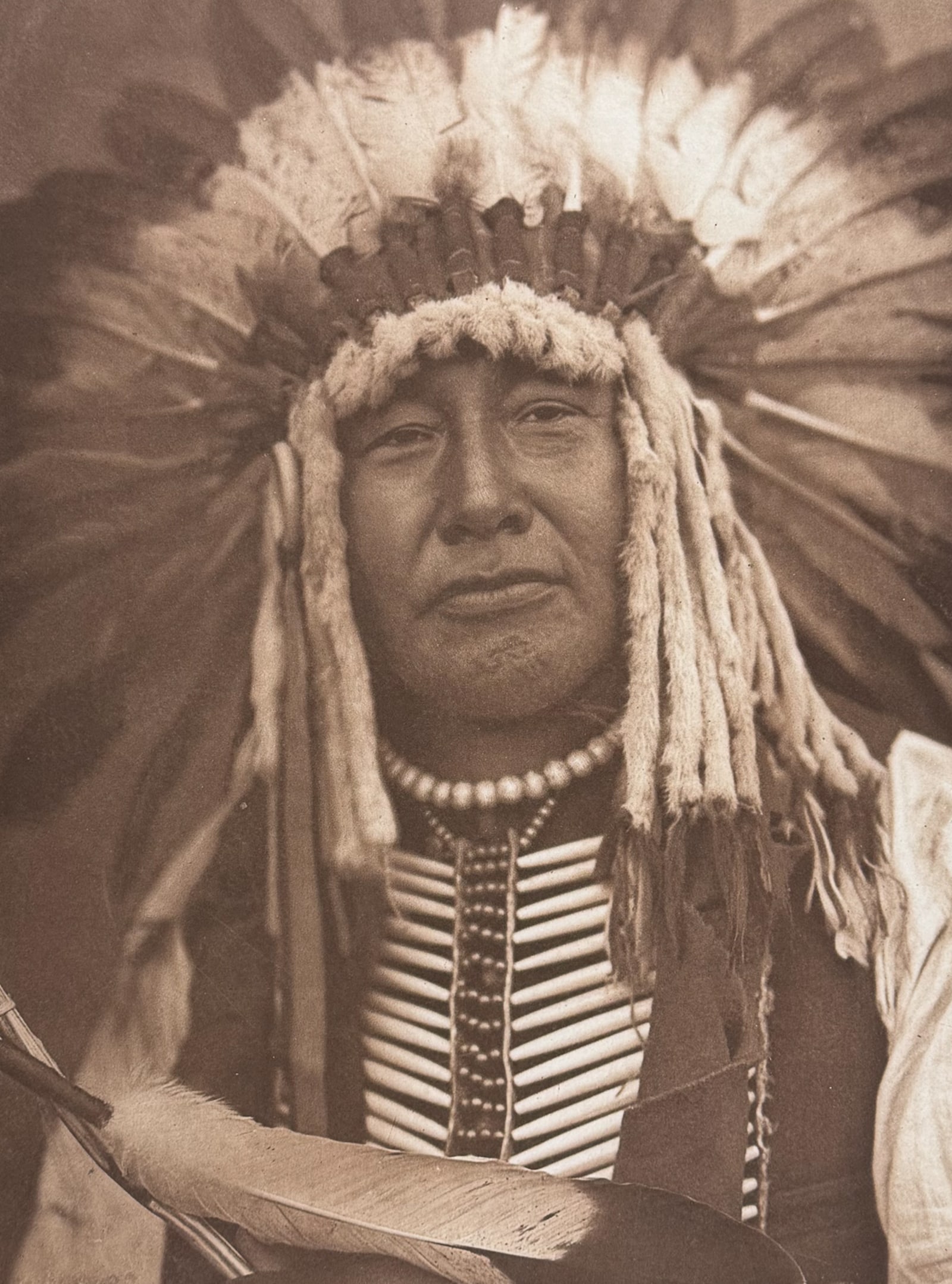 Edward Curtis, Folio - Yellow Owl - Mandan: This moving photogravure in folio size is from Edward Curtis's The North American Indian being a Series of Volumes Picturing and Describing the Indians of the United States and Alaska. Edited by Frede