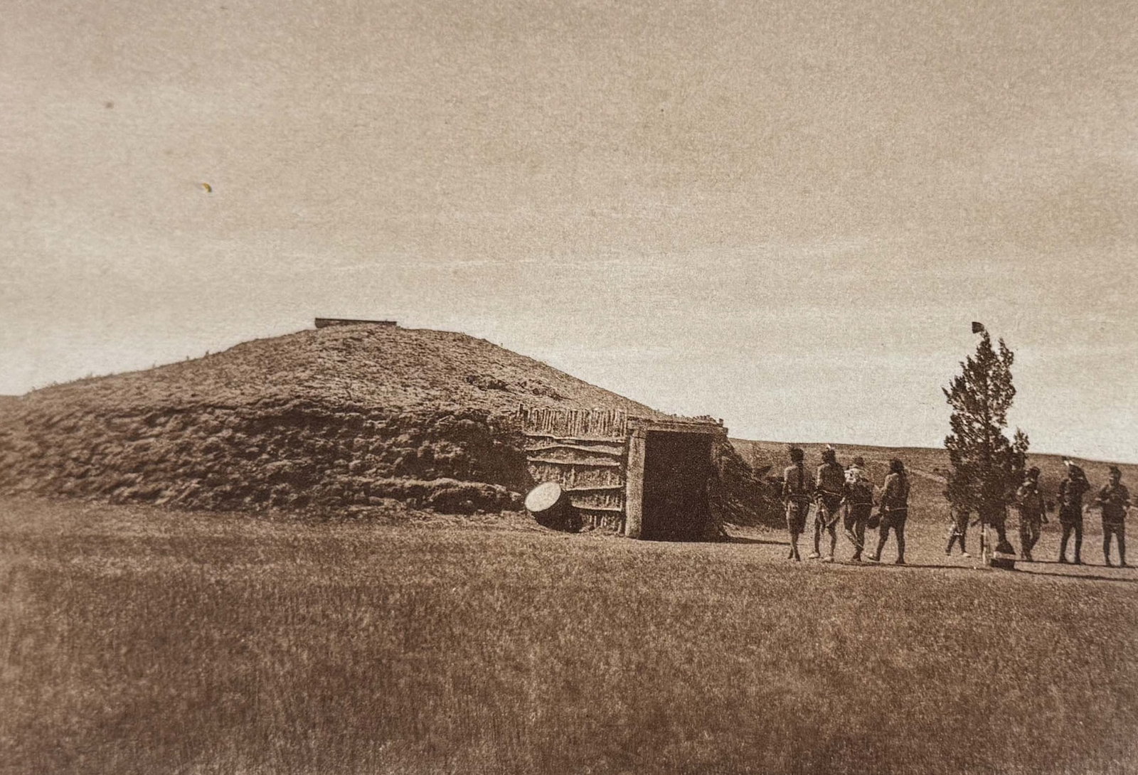 Edward Curtis - Arikara Medicine-lodge: This moving photogravure in quarto size is from Edward Curtis's The North American Indian being a Series of Volumes Picturing and Describing the Indians of the United States and Alaska. Edited by Fred