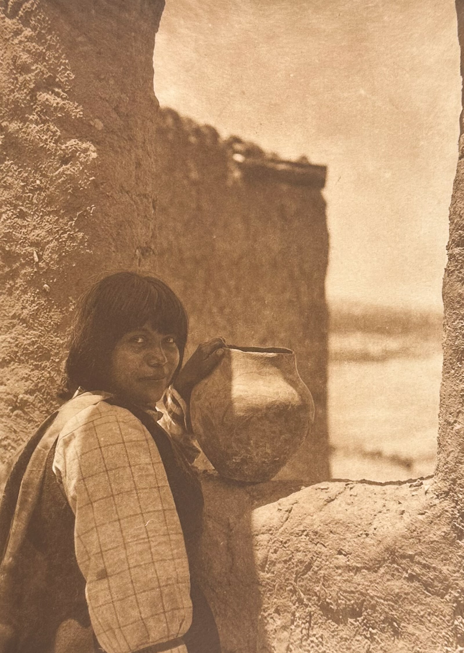 Edward Curtis, Folio - Timu - Cochiti: Description of the image: This Cochiti girl married a Sia man, and the photograph was made at her adopted home. Description of the work: This moving photogravure is from Edward Curtis's The North Amer
