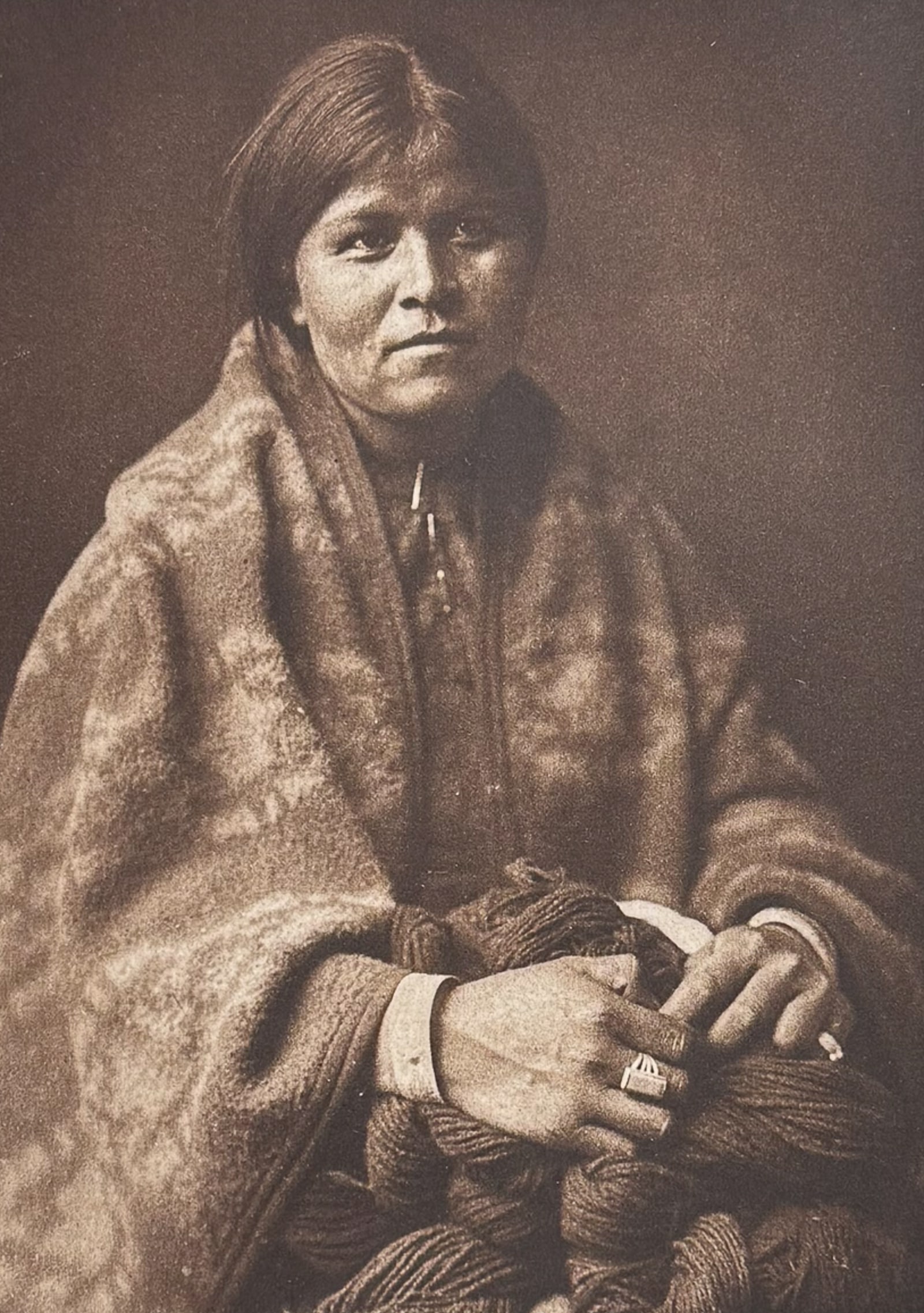 Edward Curtis - The Blanket Maker - Navaho: This moving photogravure in quarto size is from Edward Curtis's The North American Indian being a Series of Volumes Picturing and Describing the Indians of the United States and Alaska. Edited by