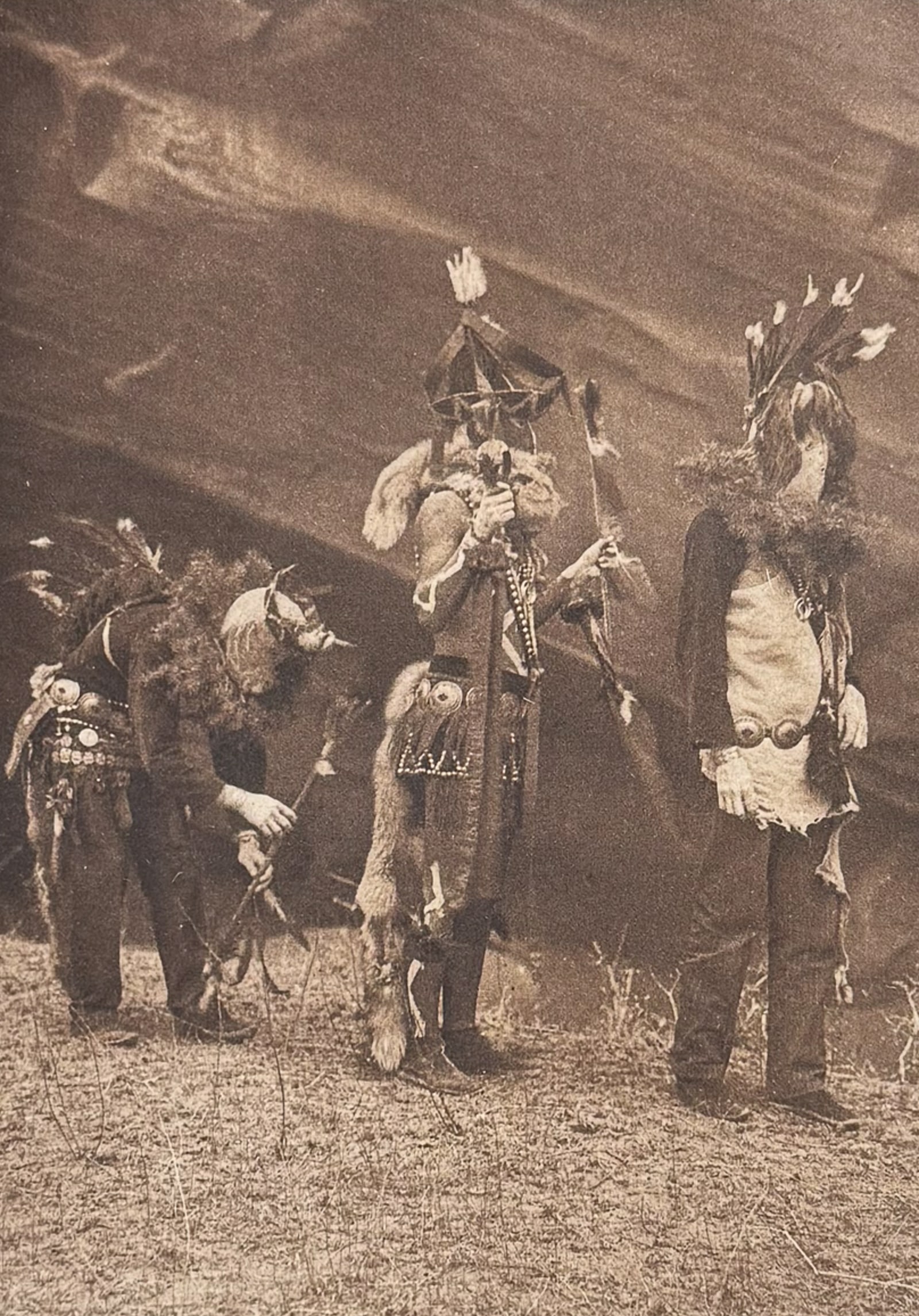 Edward Curtis - Garaskidi, Zahadolzha, Haschelti - Navaho: This moving photogravure in quarto size is from Edward Curtis's The North American Indian being a Series of Volumes Picturing and Describing the Indians of the United States and Alaska. Edited by