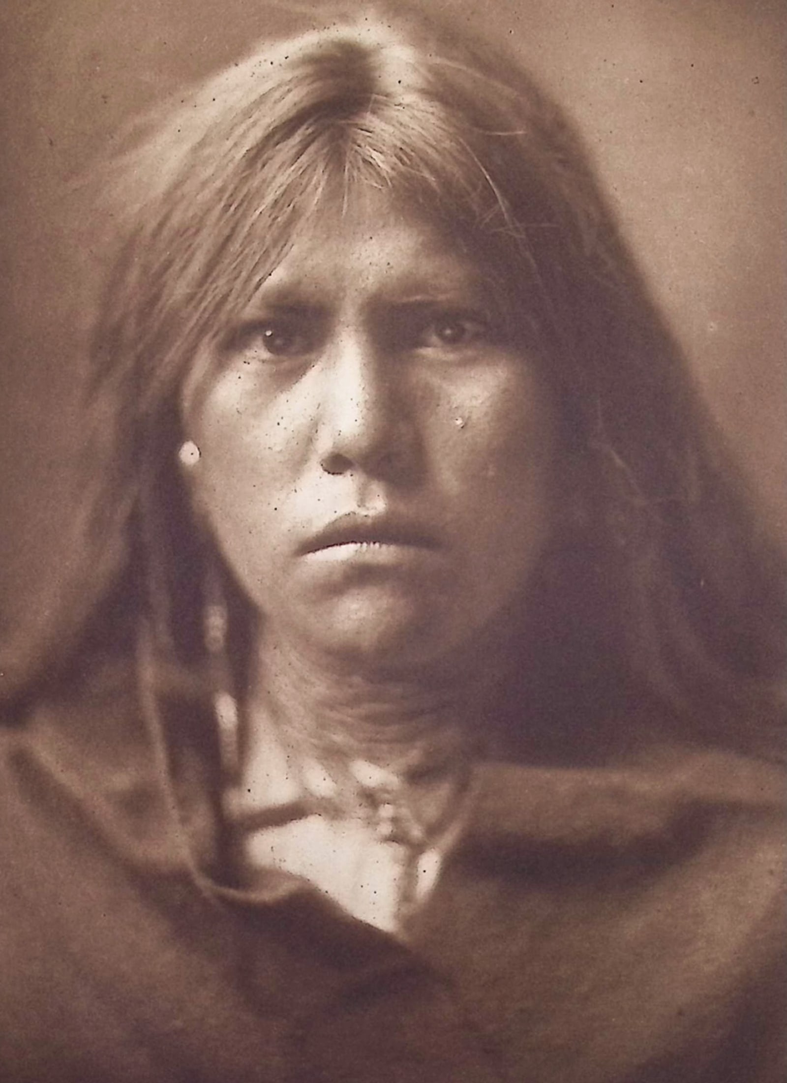 Edward Curtis - Tenokai - Apache: This moving photogravure in quarto size is from Edward Curtis's The North American Indian being a Series of Volumes Picturing and Describing the Indians of the United States and Alaska. Edited by