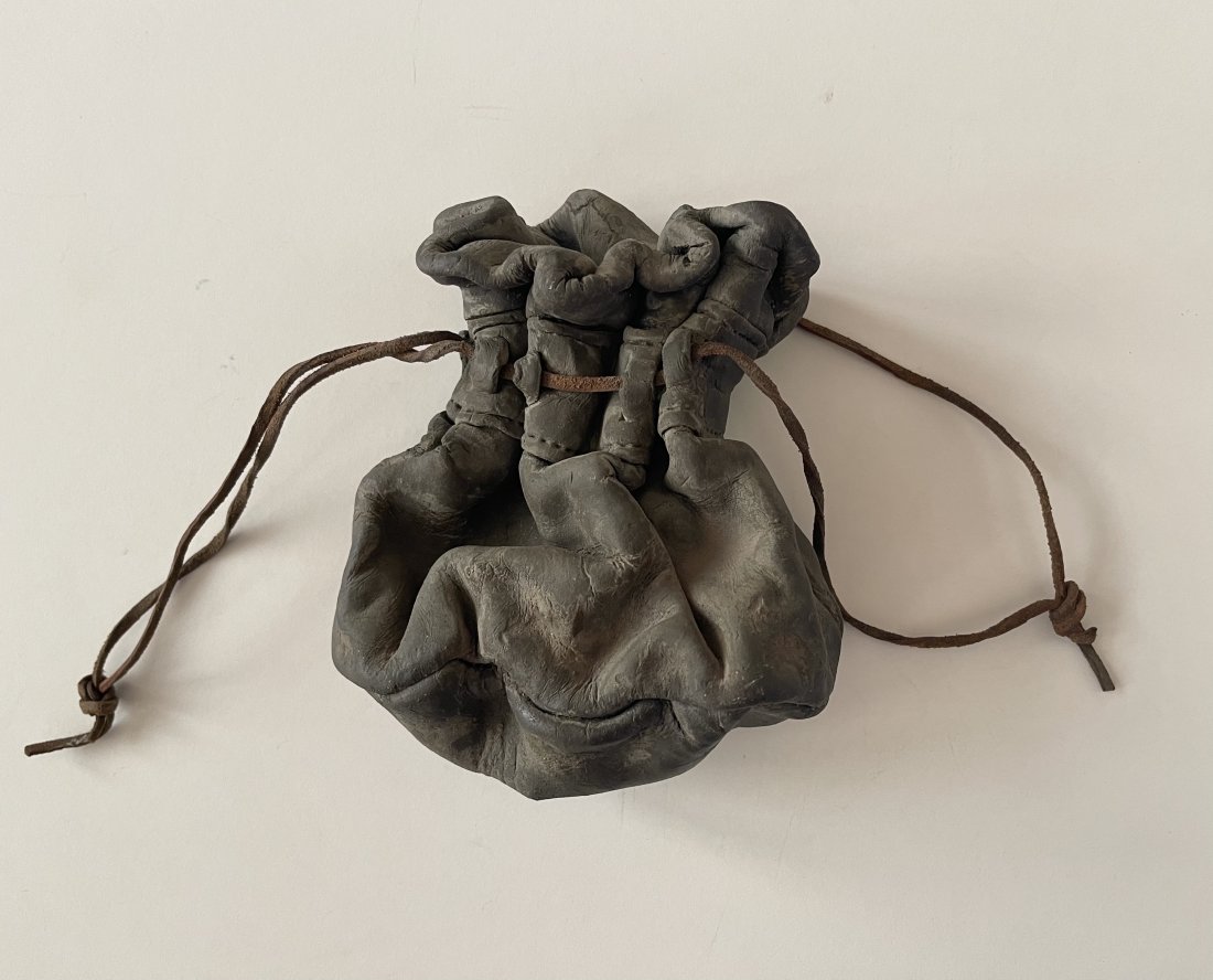 Marilyn Levine, Trompe L'oeil Ceramic Leather Pouch: Marilyn Levine Untitled leather pouch with drawstring Cast ceramic sculpture with leather string 6 x 3 x 3 inches Unsigned $35 domestic shipping Marilyn Levine (1935-2005) was an Oakland-based ce