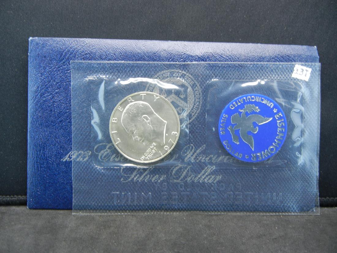 1973-S Ike Silver Dollar. Unc In Government Package (1 of 3)