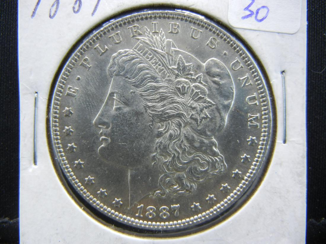 1887 Morgan Dollar.   Almost Uncirculated. (1 of 3)