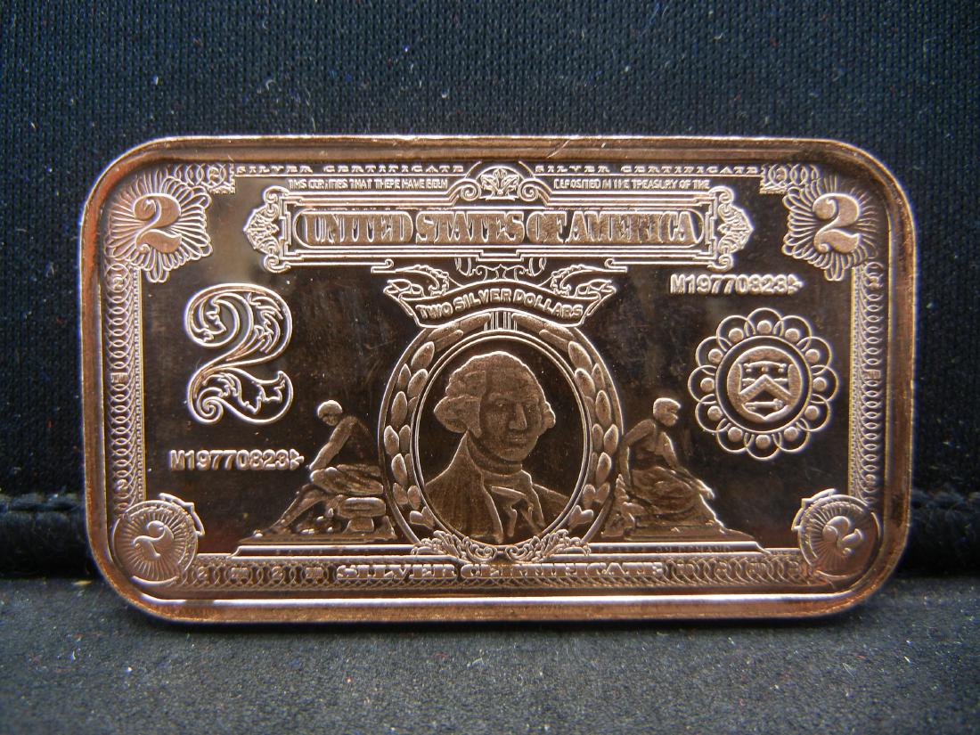 1 oz. Copper Bar with $2 Note Depicted. (1 of 2)