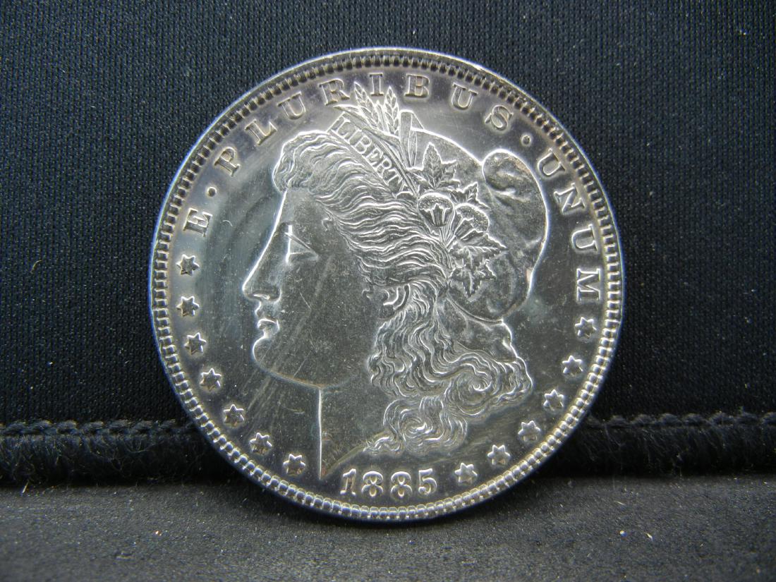 1885 Morgan Silver Dollar. Toned (1 of 2)