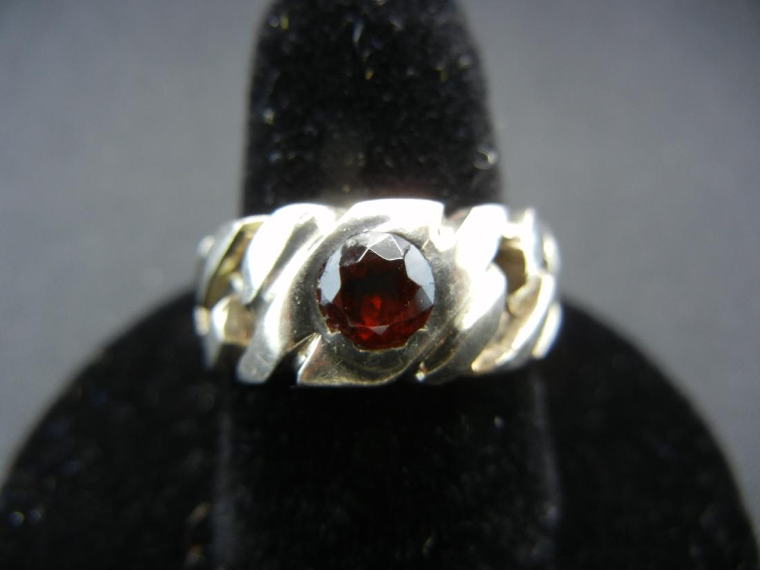 Sterling Ring Size 8 with garnet colored stone.: Sterling Ring Size 8 with garnet colored stone.
