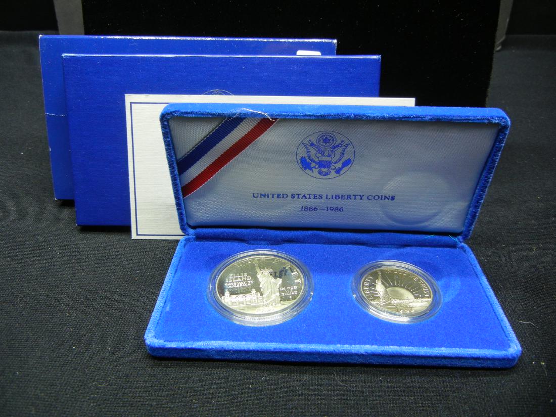 1986-S Ellis Island Silver dollar and half dollar.: 1986-S Ellis Island Silver dollar and half dollar. Gem Proof in original box.