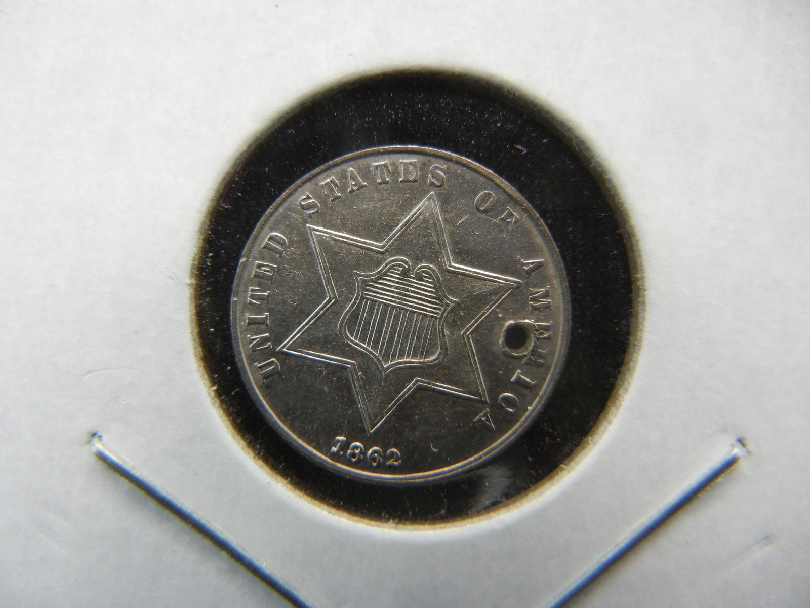 1862 Three Cent Silver.  Almost Uncirculated but holed. (1 of 3)