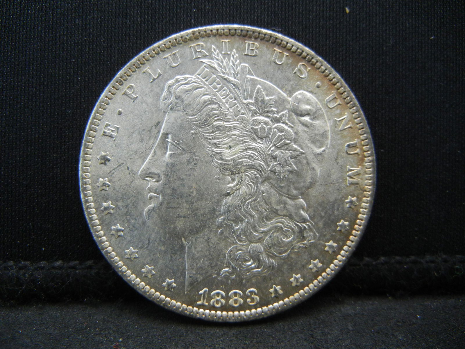 1883-O Uncirculated Morgan Silver Dollar. (1 of 2)