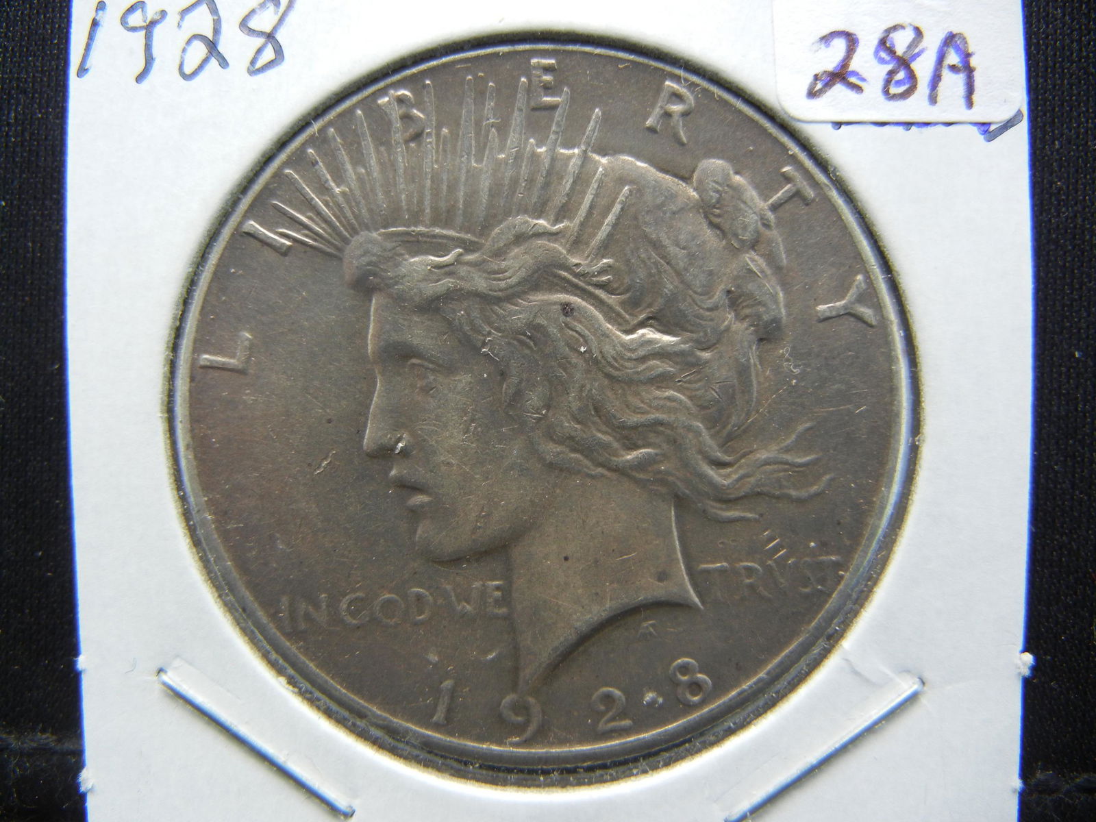 1928 Peace Dollar.  Almost Uncirculated. (1 of 3)