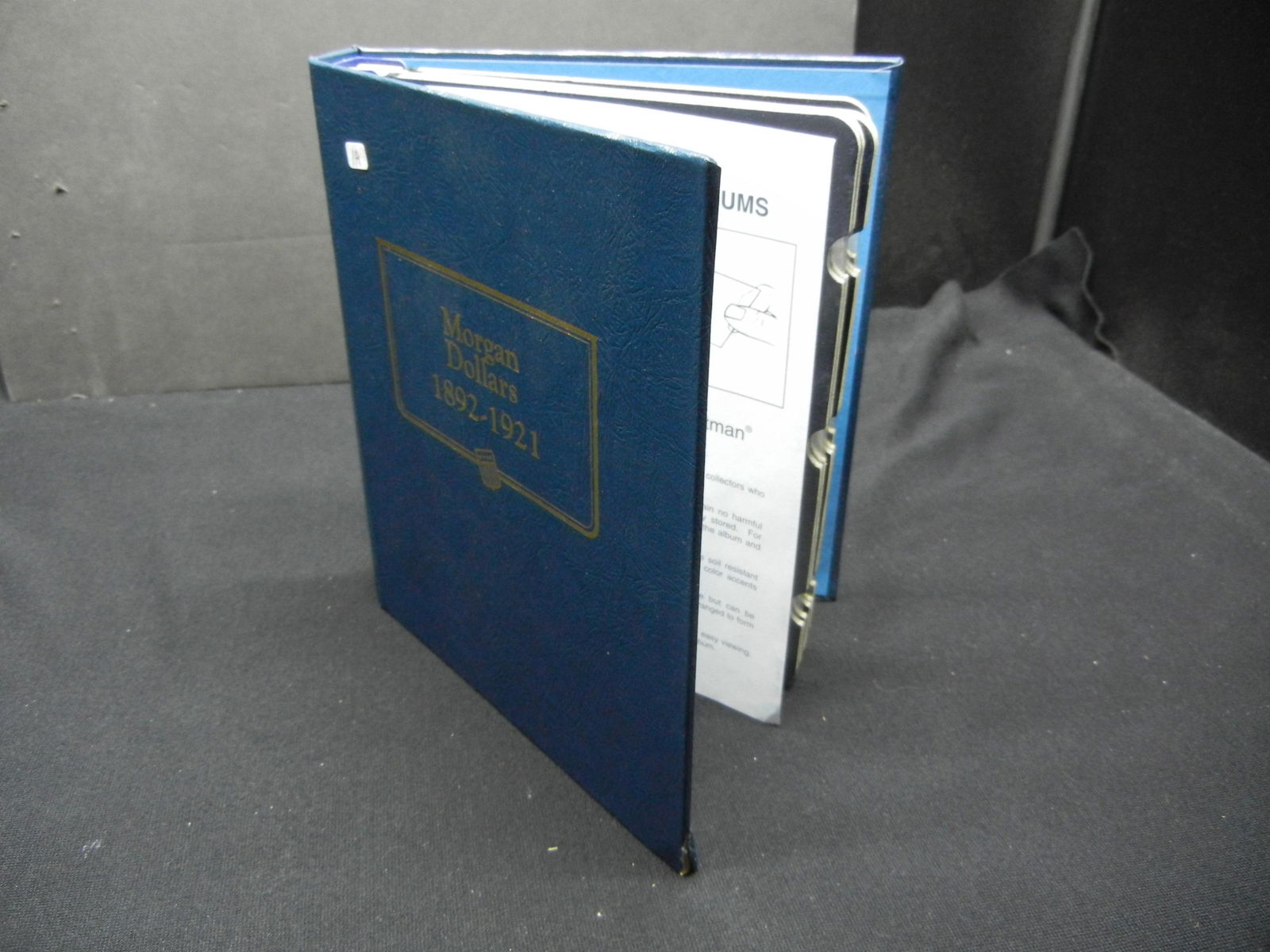 Empty Whitman Morgan Dollar Bookshelf Album, 1892-1921. (1 of 6)