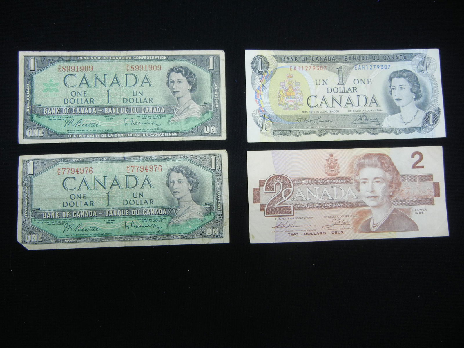 3 $1 and 1 $2 Canada notes (1 of 5)