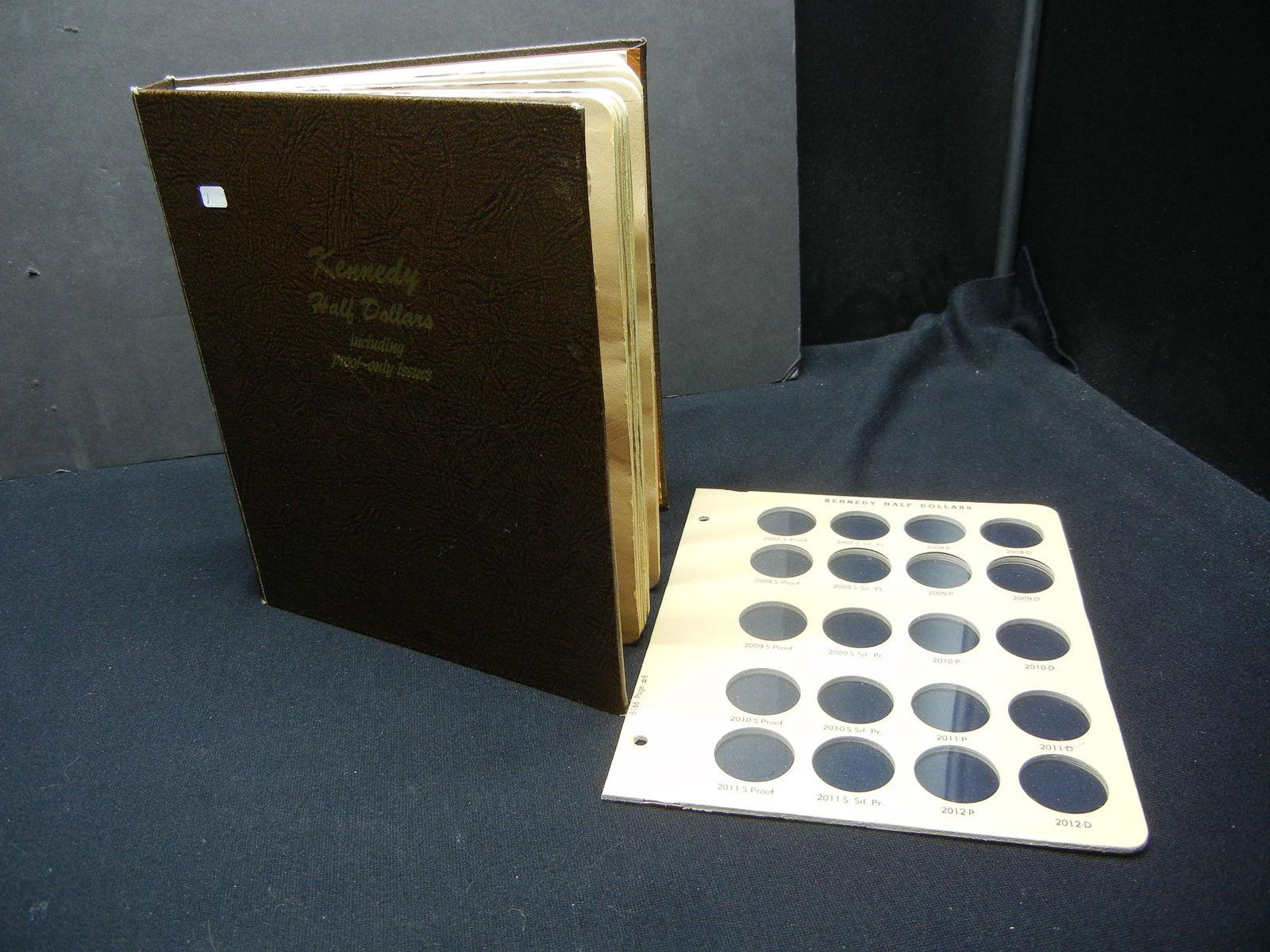 Empty Kennedy Half Dollar with Proof Dansco Album 8166. (1 of 9)