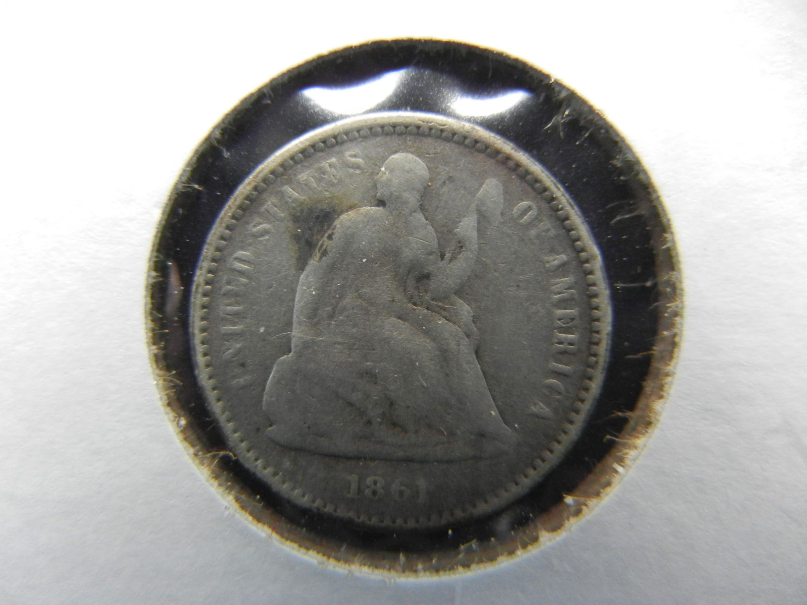 1861 Half Dime.  VG. (1 of 3)