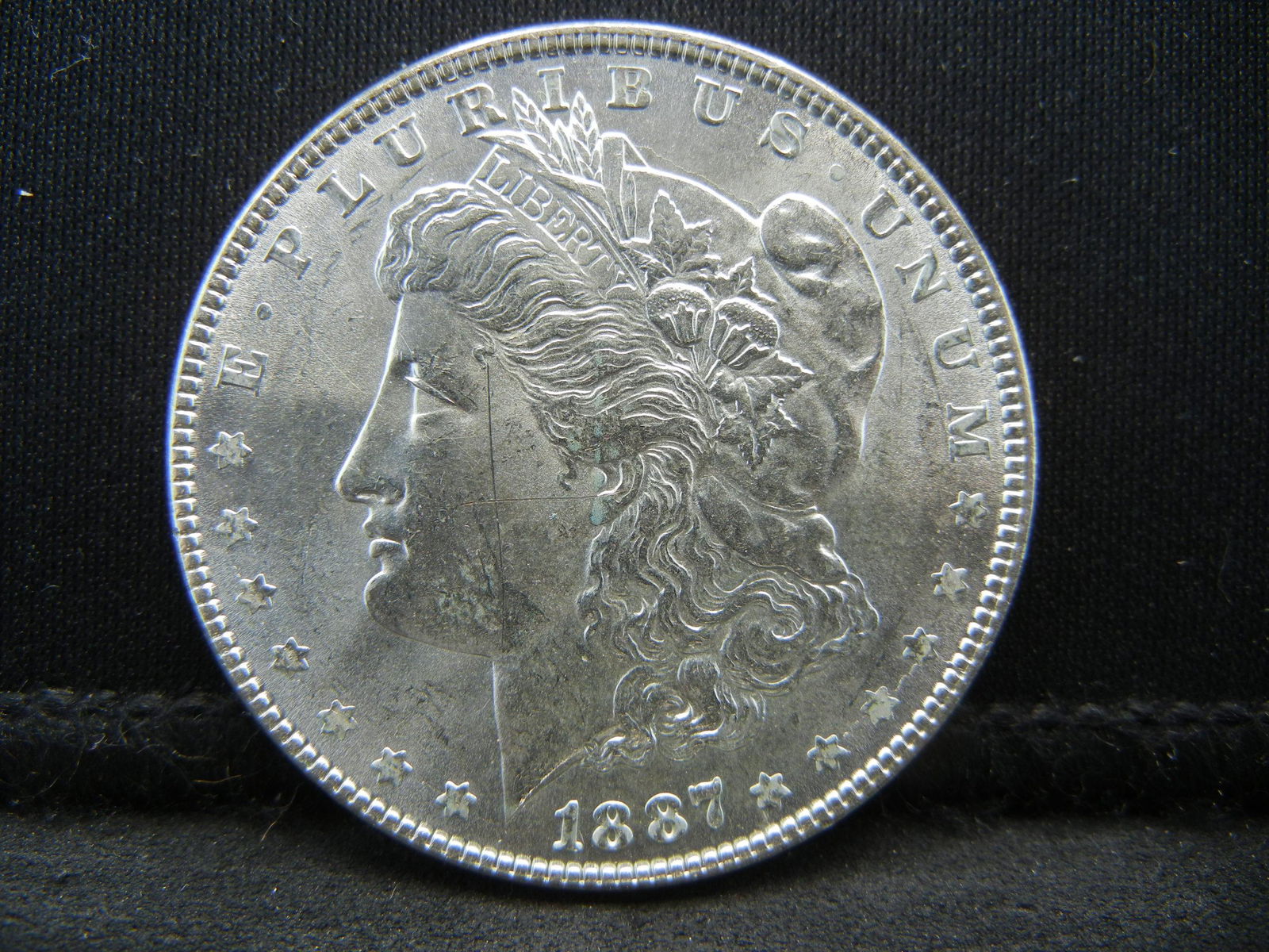 1887 Morgan Dollar BU Scratch Obv (1 of 2)
