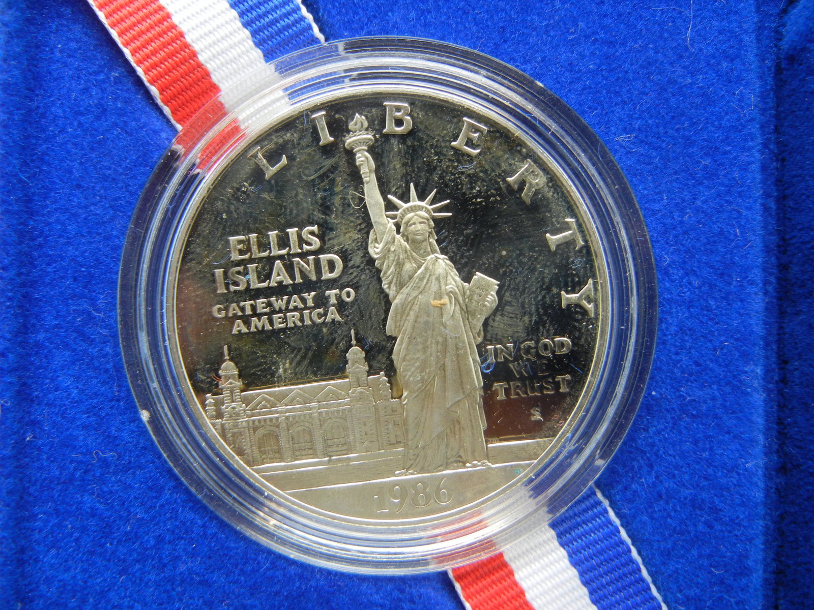 1986-S Statue of Liberty (Ellis Island) Comm Silver $1.: 1986-S Statue of Liberty (Ellis Island) Comm Silver $1. GEM Proof in government box.