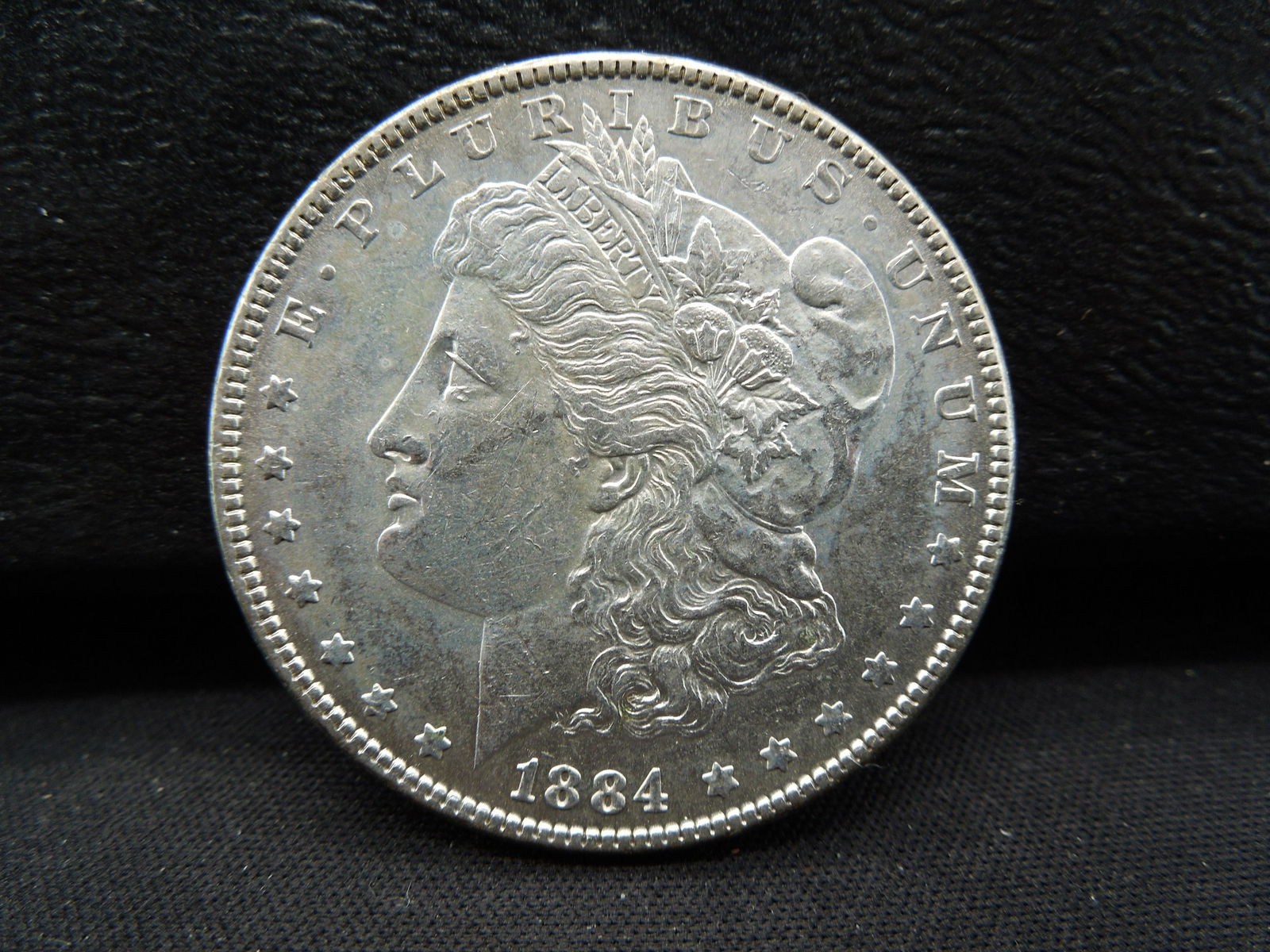 1884 Morgan Dollar Higher Grade better Date (1 of 2)