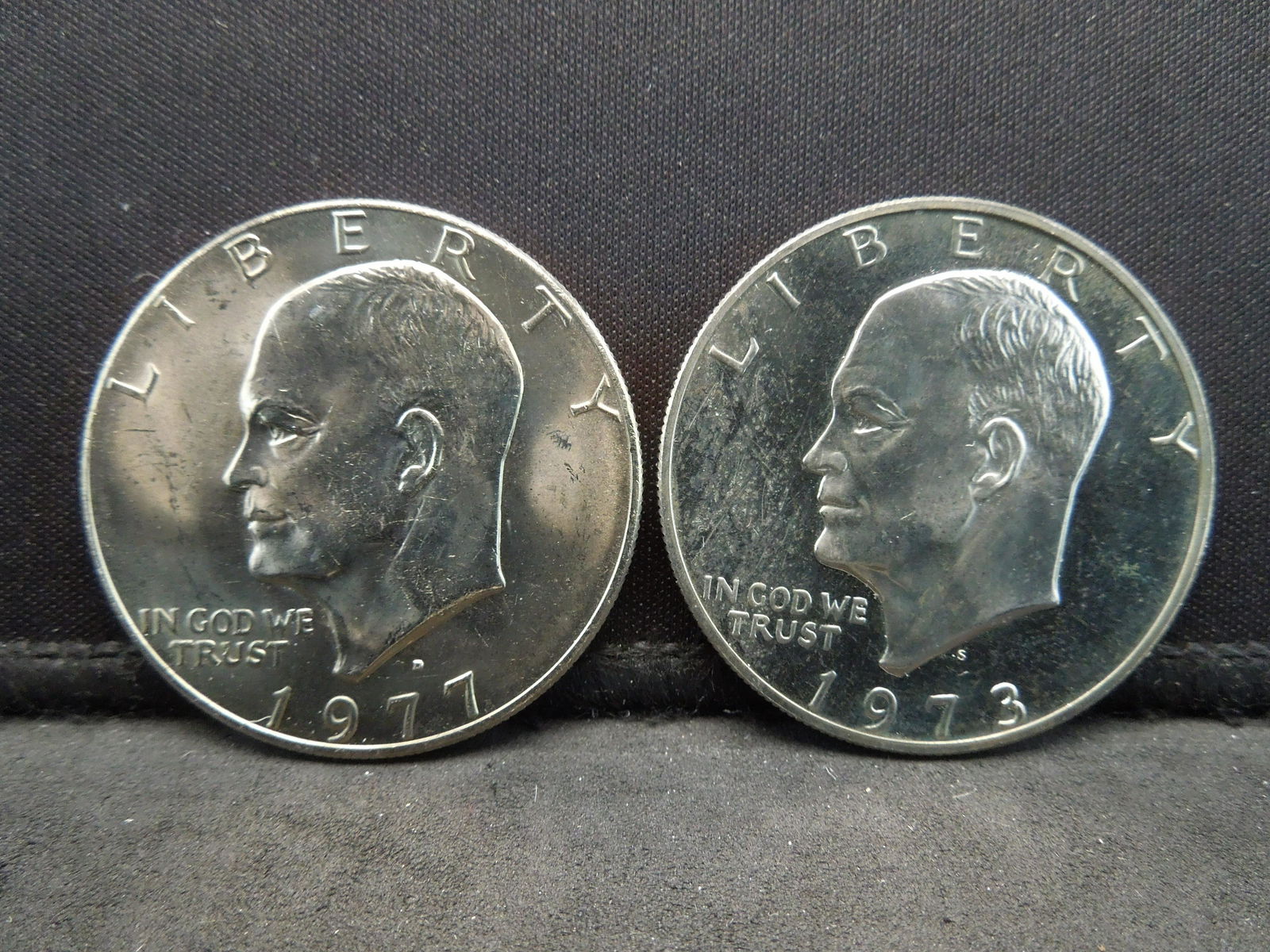 1973-s proof and uncirculated 1977-d Ike dollars (1 of 2)
