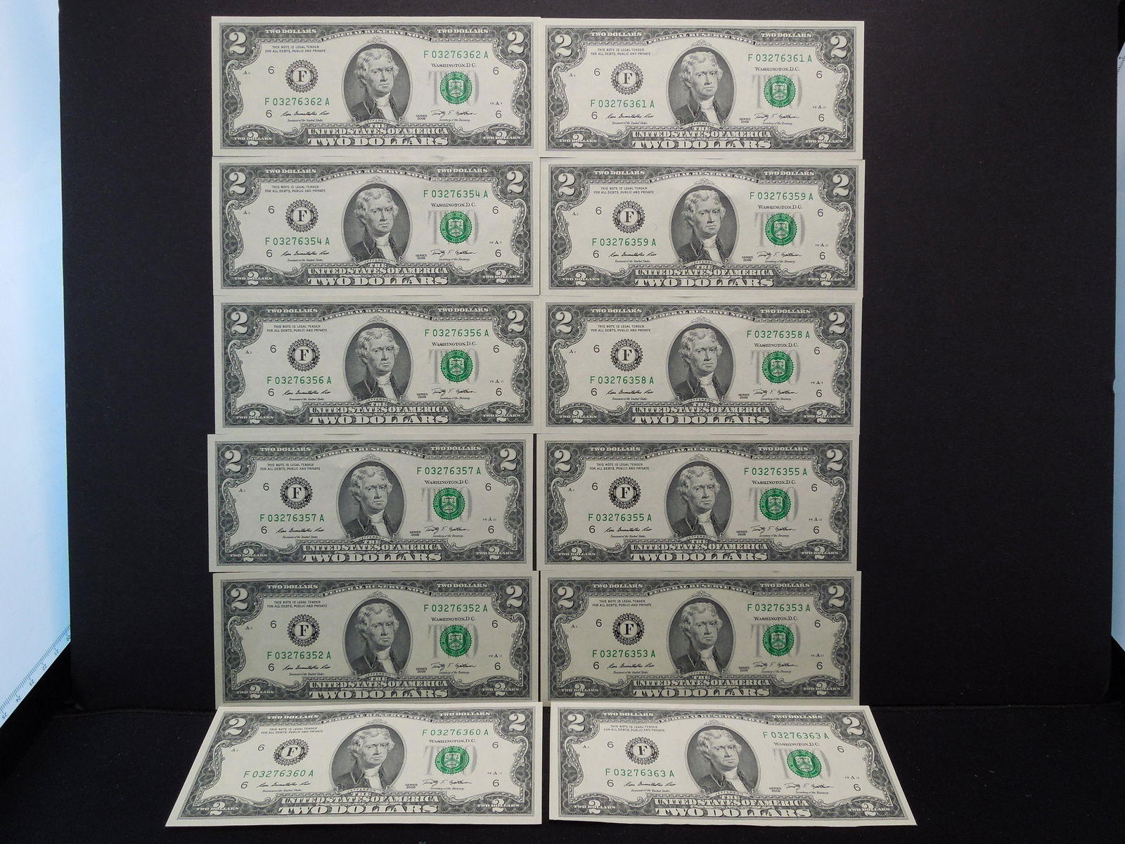 12 crisp and consecutive series of 2009 $2 notes (1 of 14)