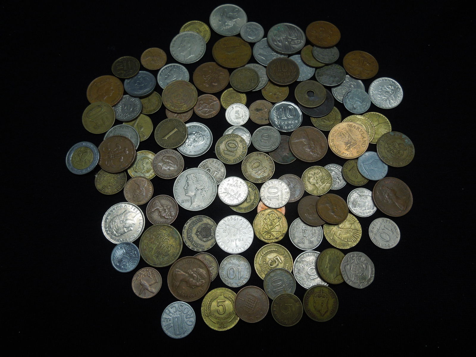 One-pound foreign coins.  Great mix. (1 of 4)