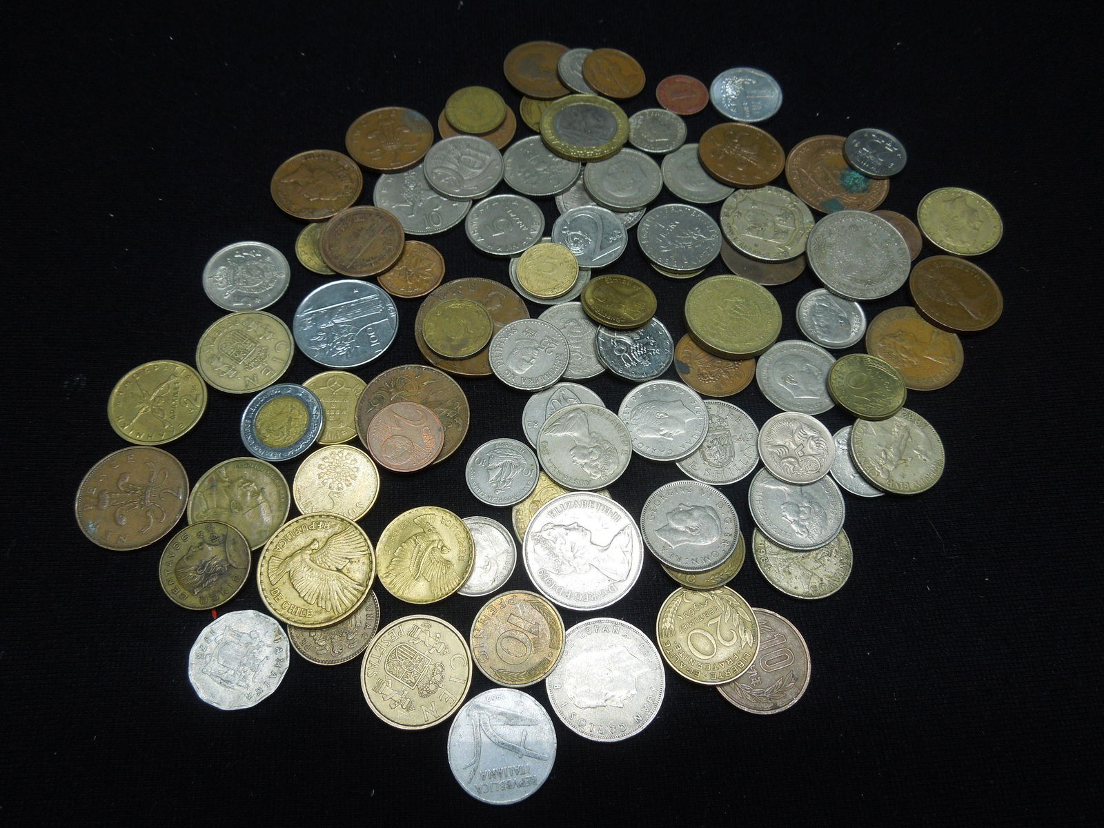 One-pound foreign coins.  Great mix. (1 of 4)