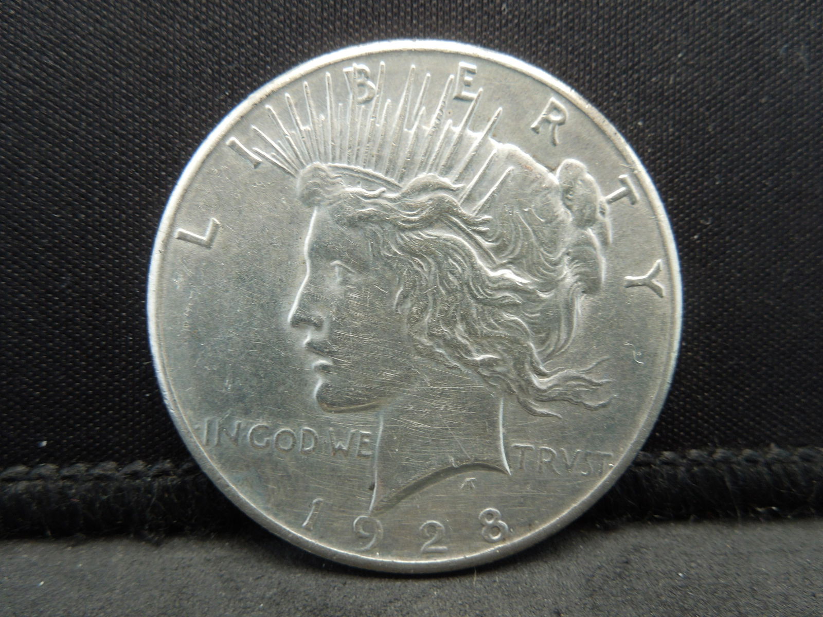 1928 Key Date Peace Silver Dollar. (1 of 2)