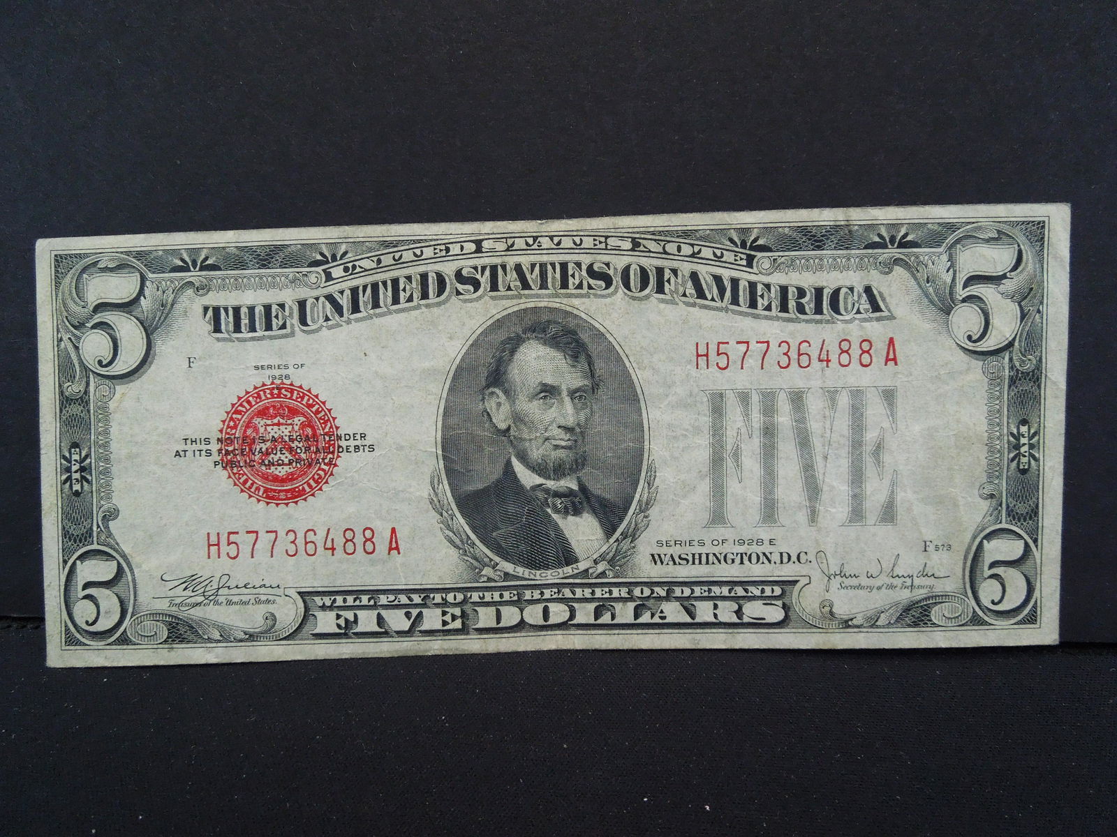 1928E $5 Red Seal.  Scarce Note.  Fine+. (1 of 3)