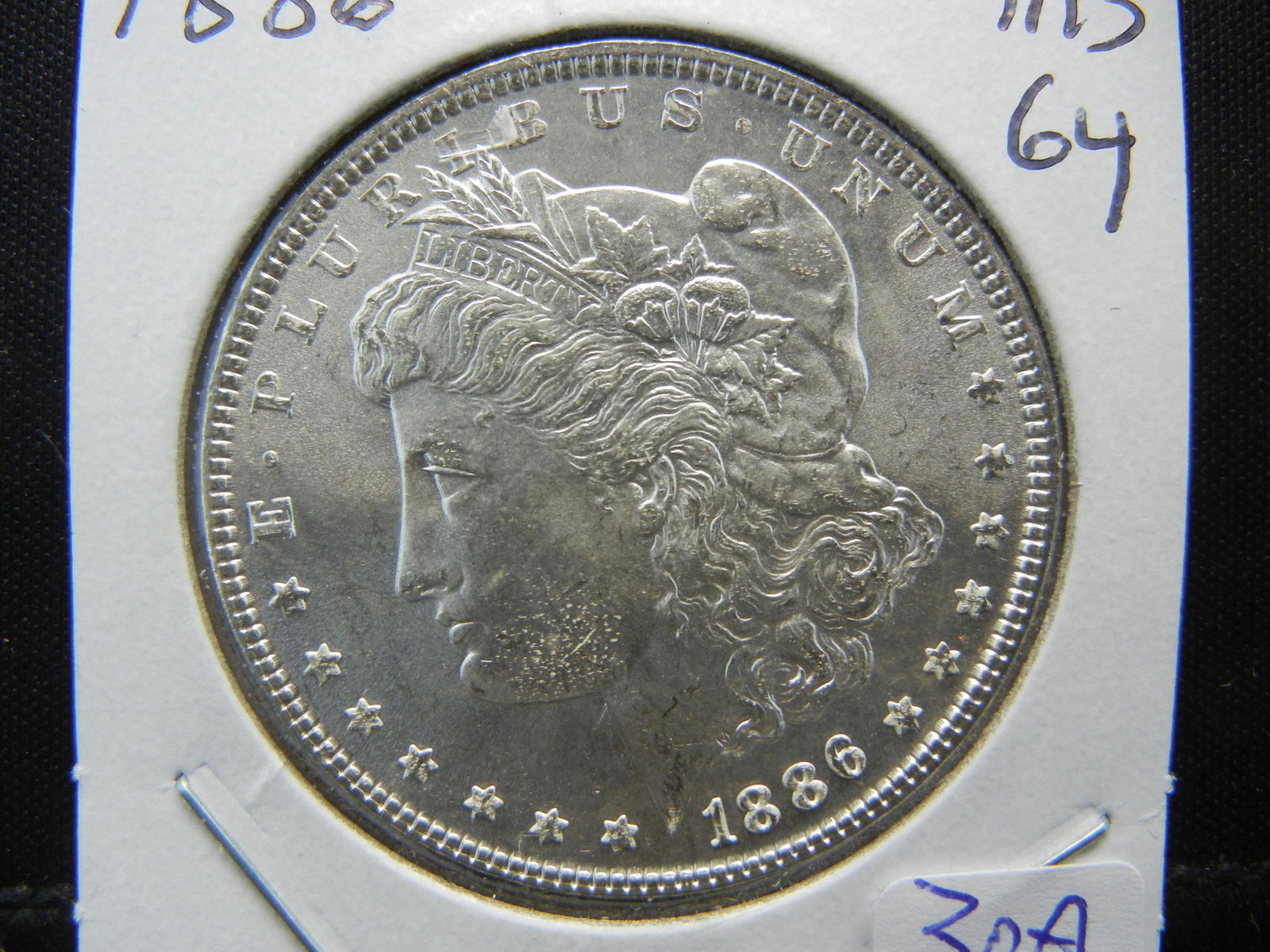 1886 Morgan Dollar.  MS 64/5  Very Clean Cheek.  White (1 of 3)