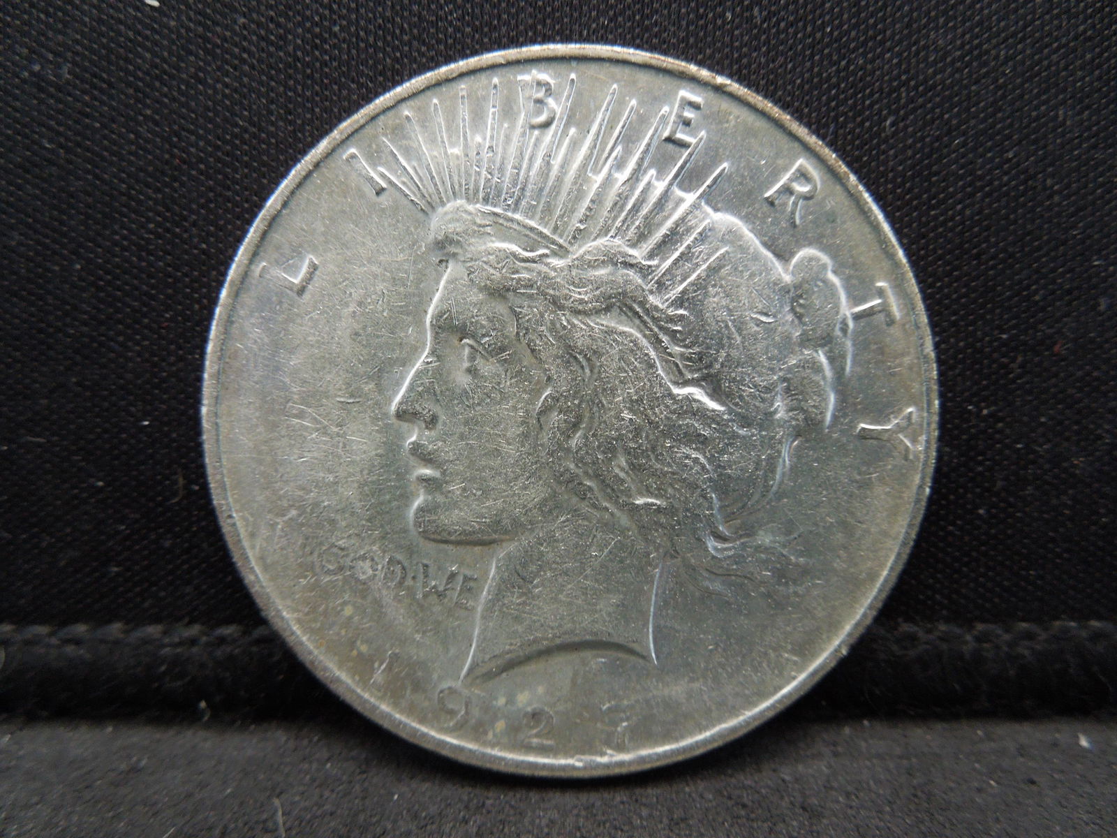 1927-D Semi-Key Date Peace Silver Dollar. (1 of 2)