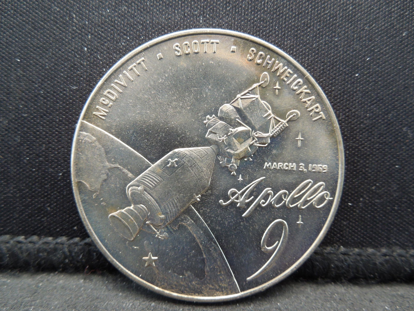 Apollo 9 Medal.  McDivitt, Scott, Schweickart.  March (1 of 2)