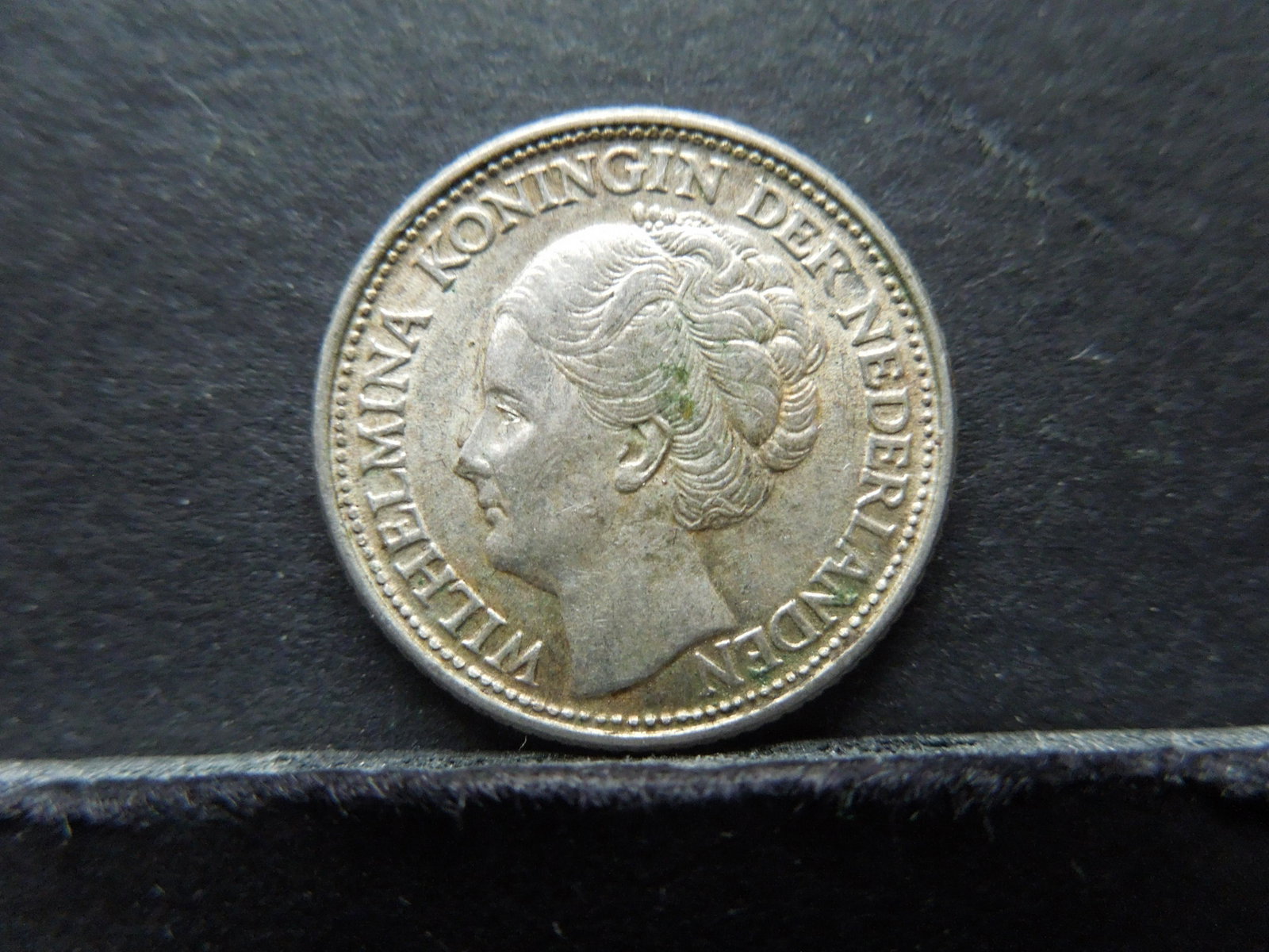 1944-P Netherland 25 Cents 64% Silver Coin. Coin: 1944-P Netherland 25 Cents 64% Silver Coin. Coin Weighs 0.12 Troy Ounce.