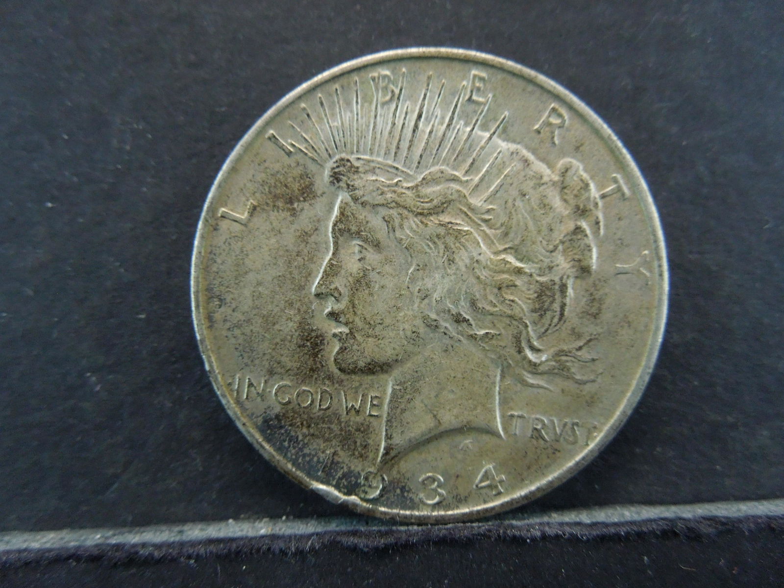 1934-D Semi-Key Date Peace Silver Dollar. (1 of 2)
