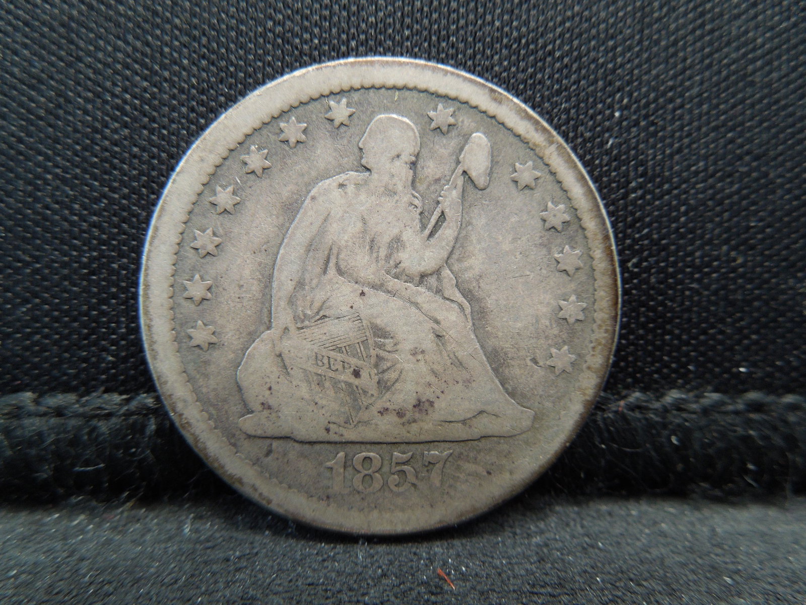 1857 Liberty Seated Quarter.  VG/Fine (1 of 2)