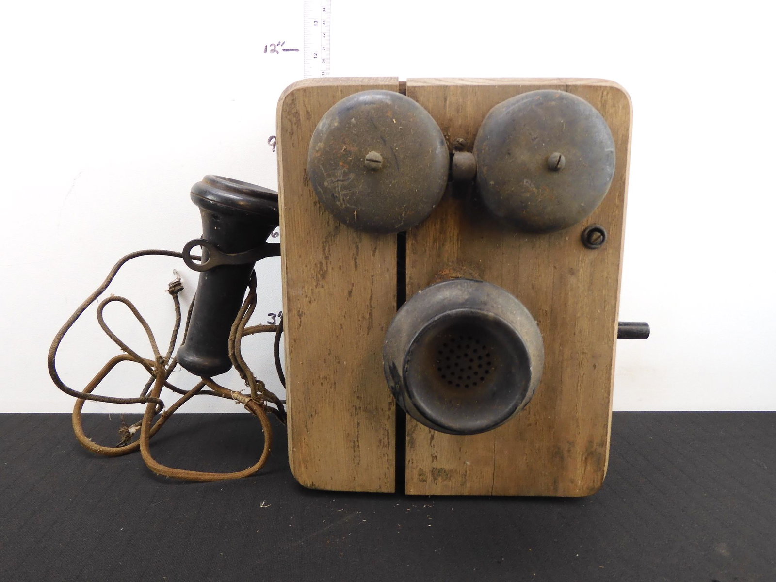 wood crank telephone, 8" x 10" x 8". insides appear: wood crank telephone, 8" x 10" x 8". insides appear intact. wood front is split - easily repairable but the whole thing needs new varnish. This came from New Bremen, Ohio, along with other Western Ohi